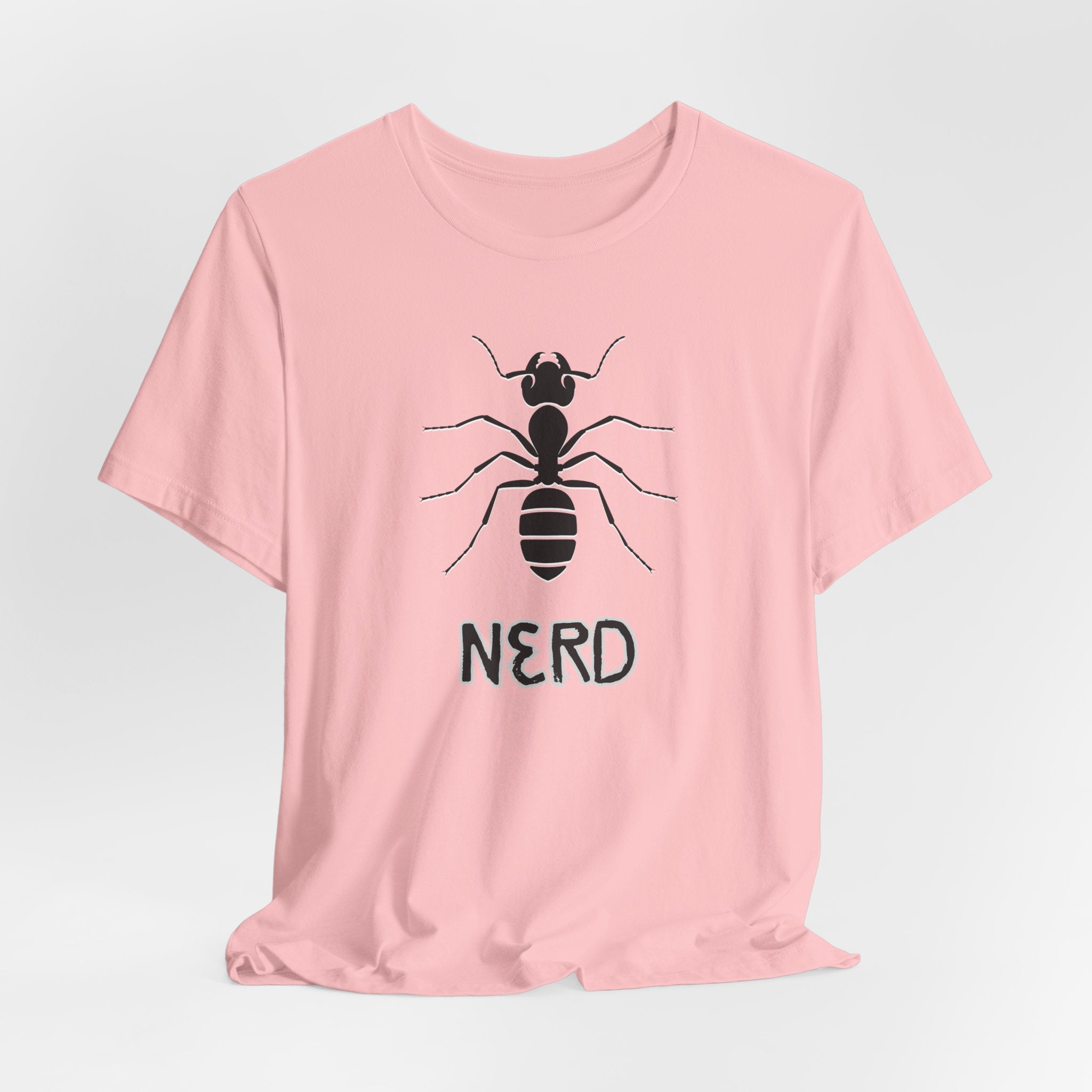 Pink t-shirt with an ant design and text nerd on a light gray background