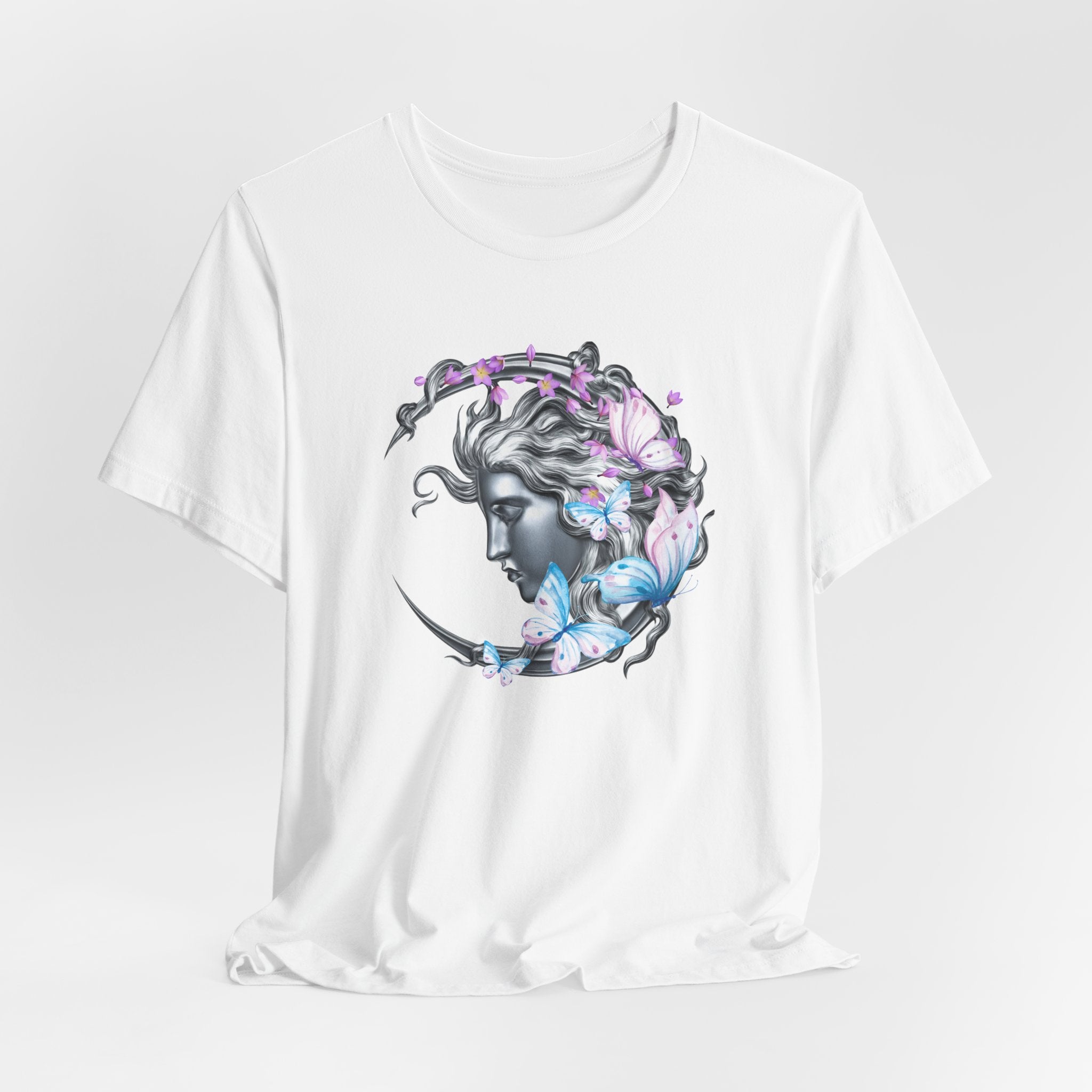 White t-shirt with a graphic design of a woman's face surrounded by butterflies on a white background