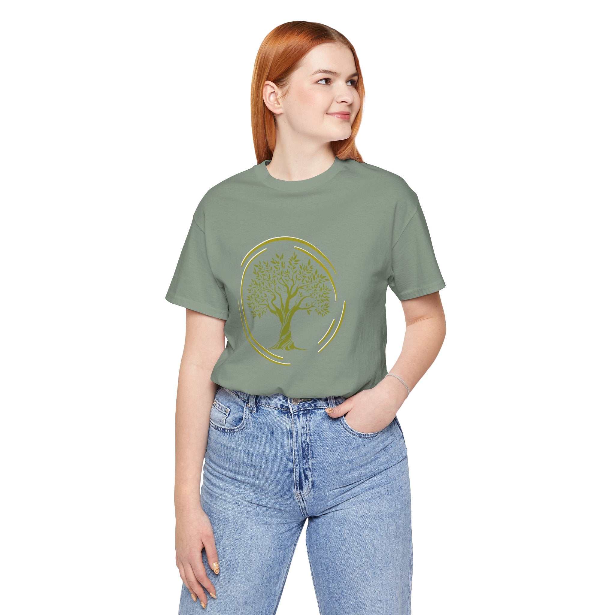 Person wearing a green t-shirt with a tree design on a white background