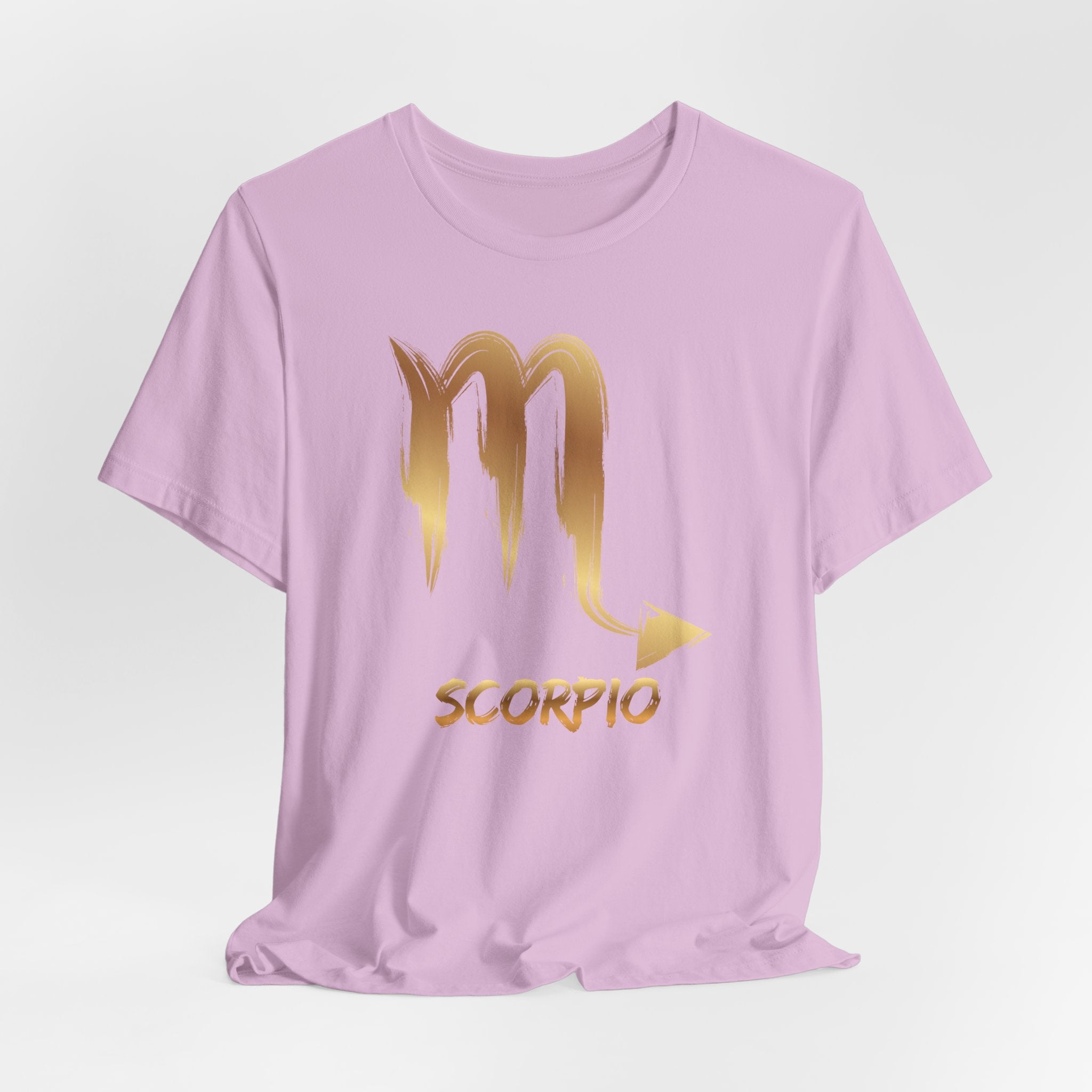 Pink t-shirt with gold Scorpio symbol and text on a white background