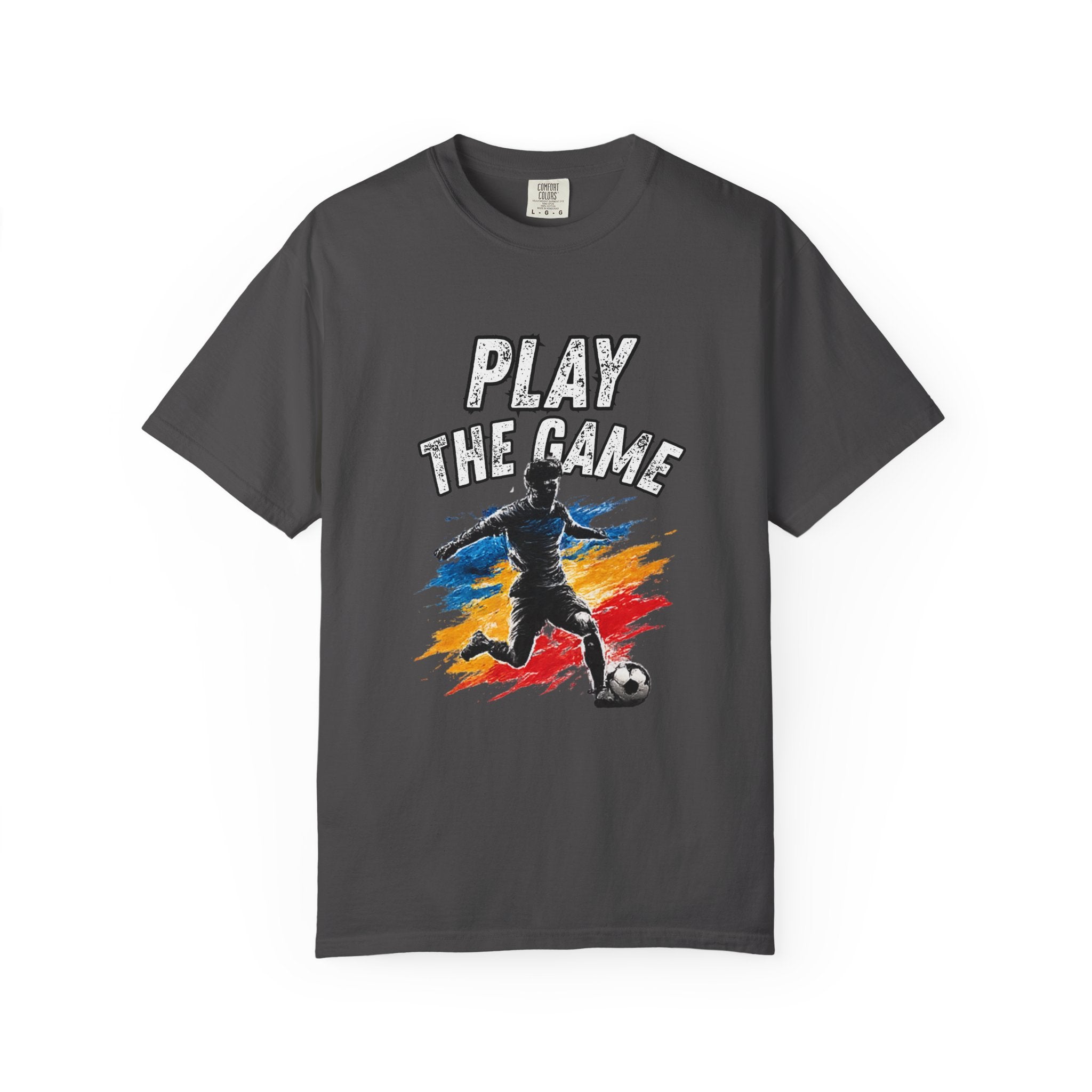 A dark gray crewneck t-shirt featuring a graphic print of a soccer player kicking a ball with the text 'PLAY THE GAME' above, set against a solid white background.