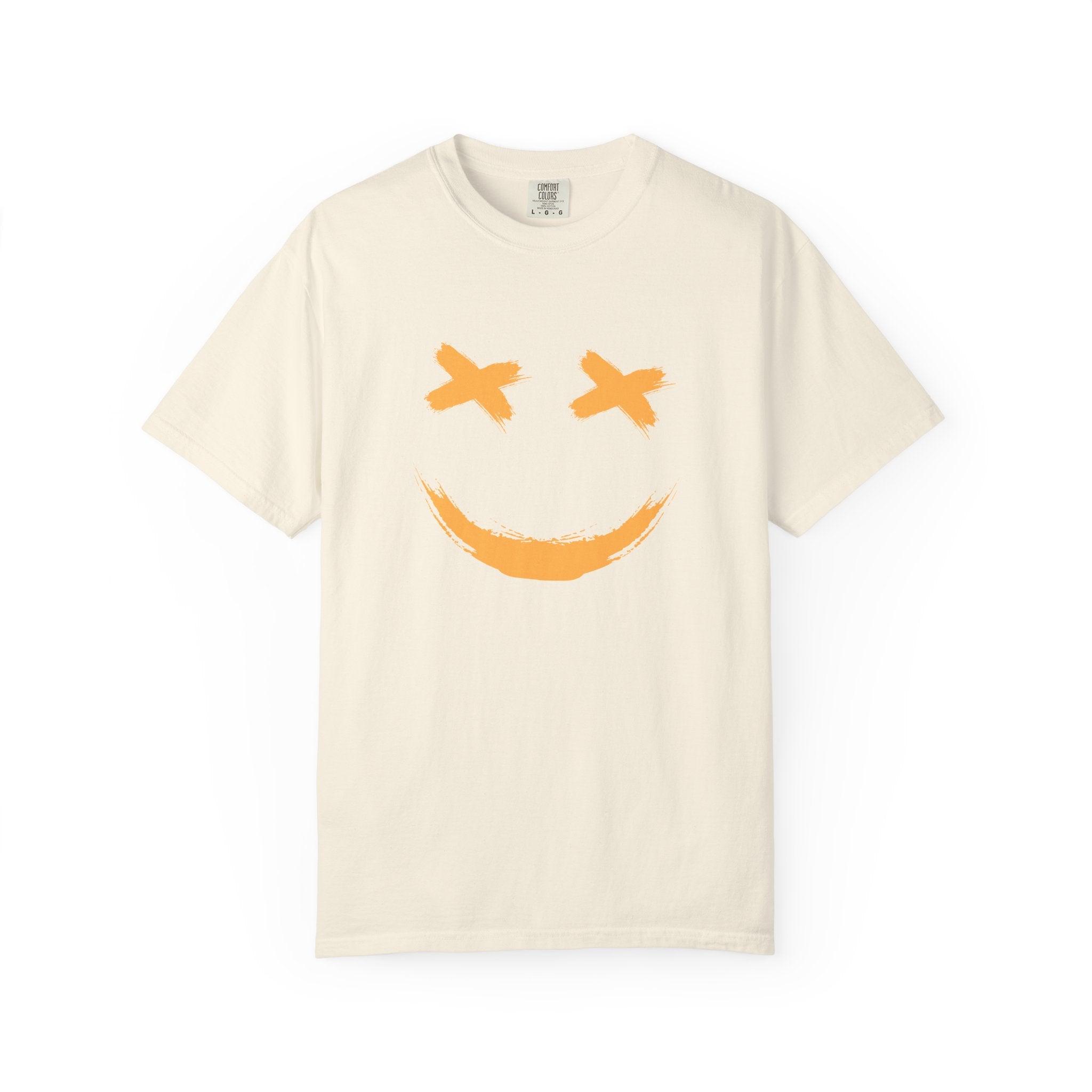 Beige t-shirt with a smiley face design on a white background