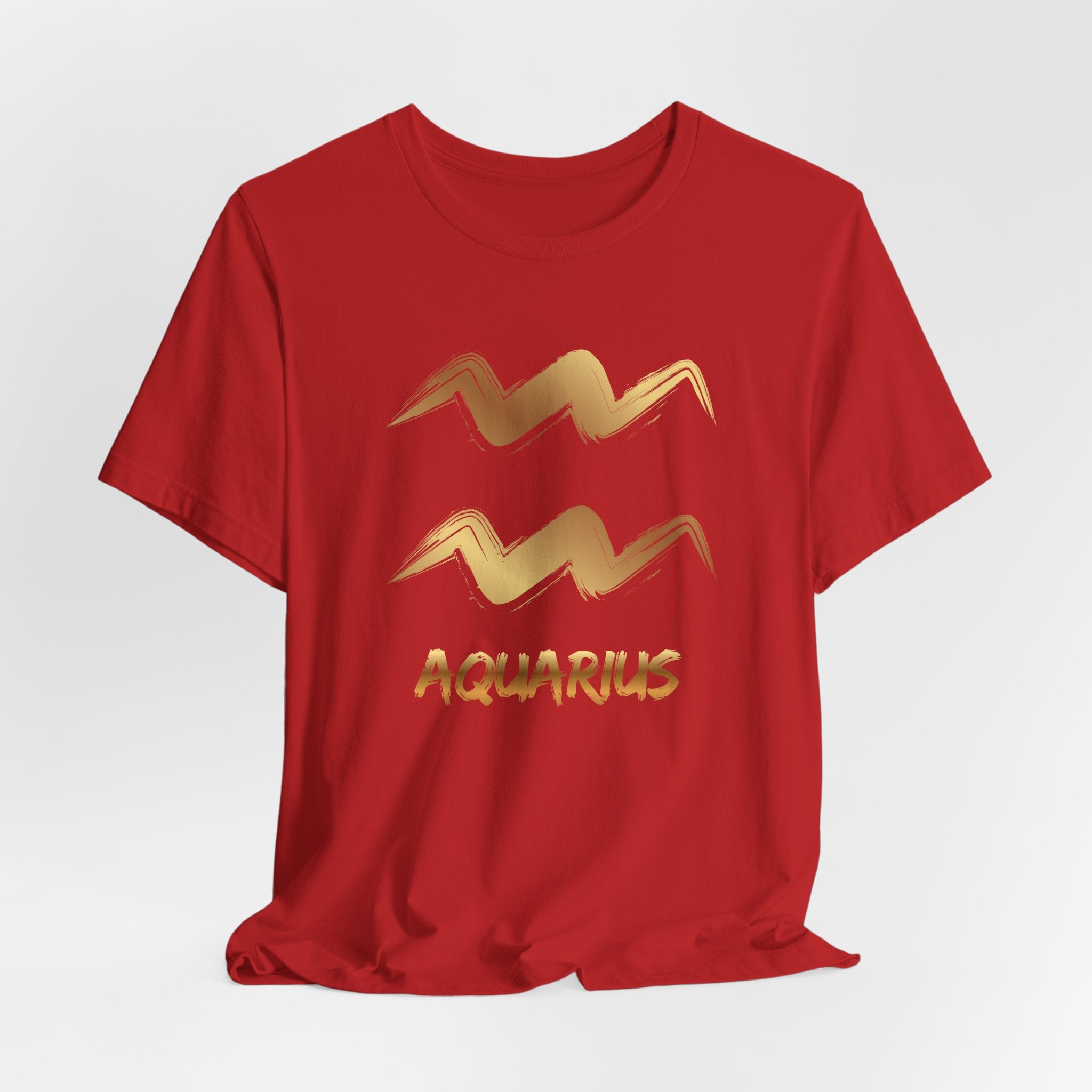 Red t-shirt with gold Aquarius zodiac sign on a white background