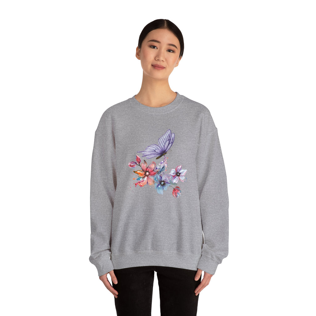 Person wearing a gray sweatshirt with butterfly and rainbow design on a white background