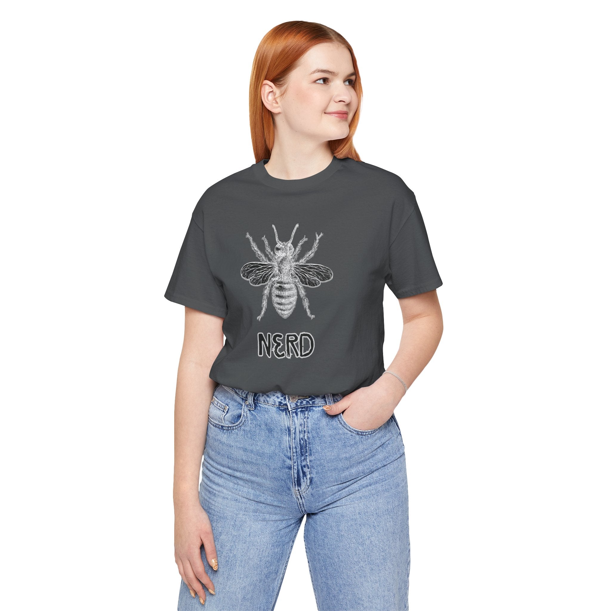 Person wearing a dark gray t-shirt with a bee graphic and 'NERD' text, standing against a white background.
