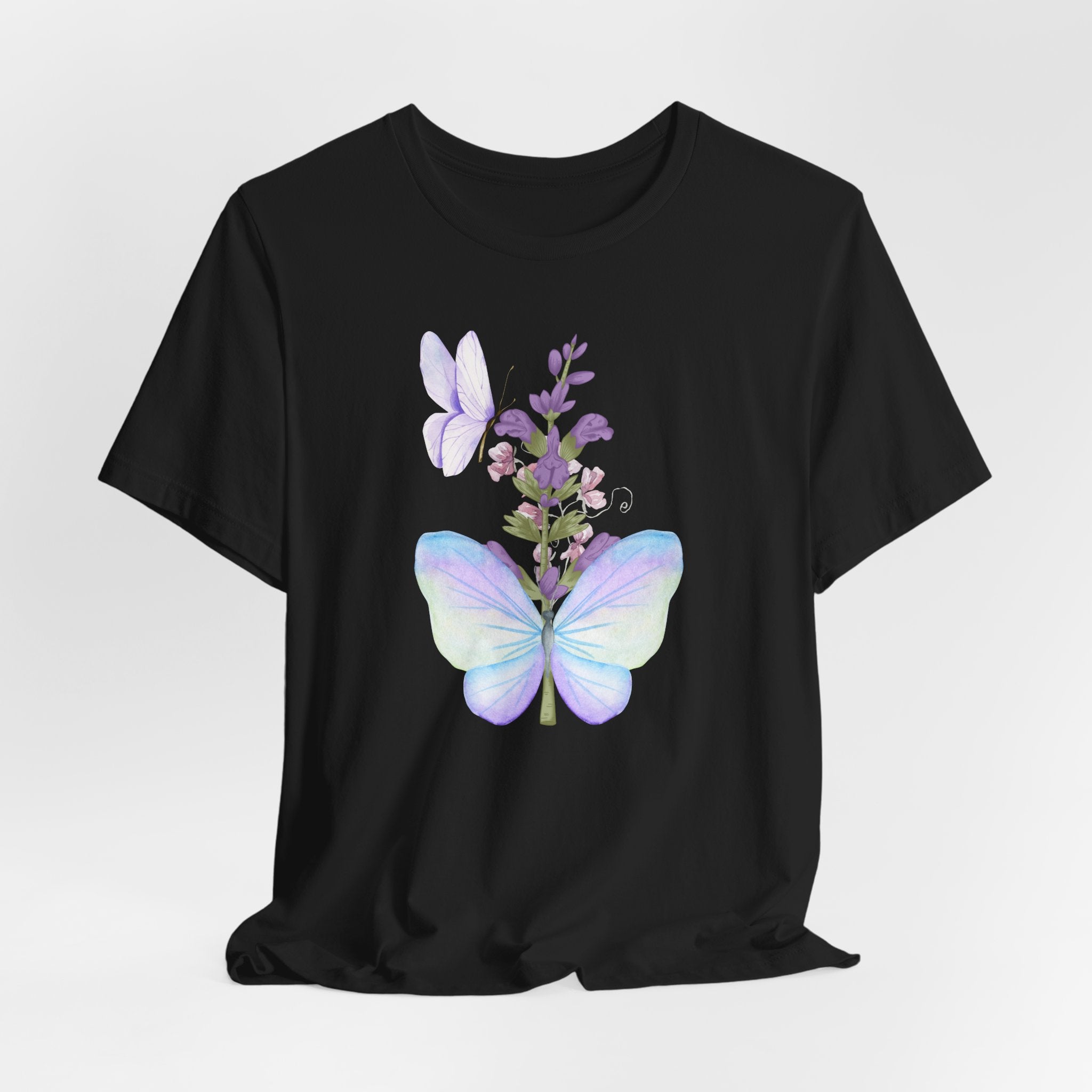Black t-shirt with a colorful butterfly and floral design on a white background