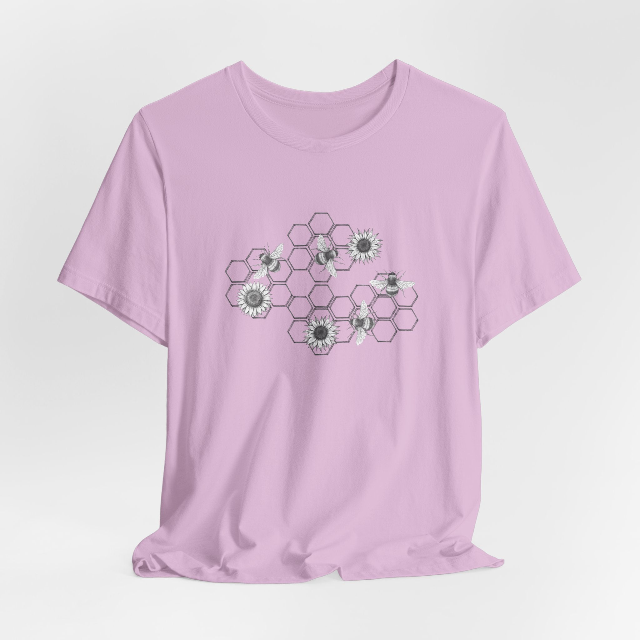 Purple t-shirt with floral and hexagonal pattern on a white background