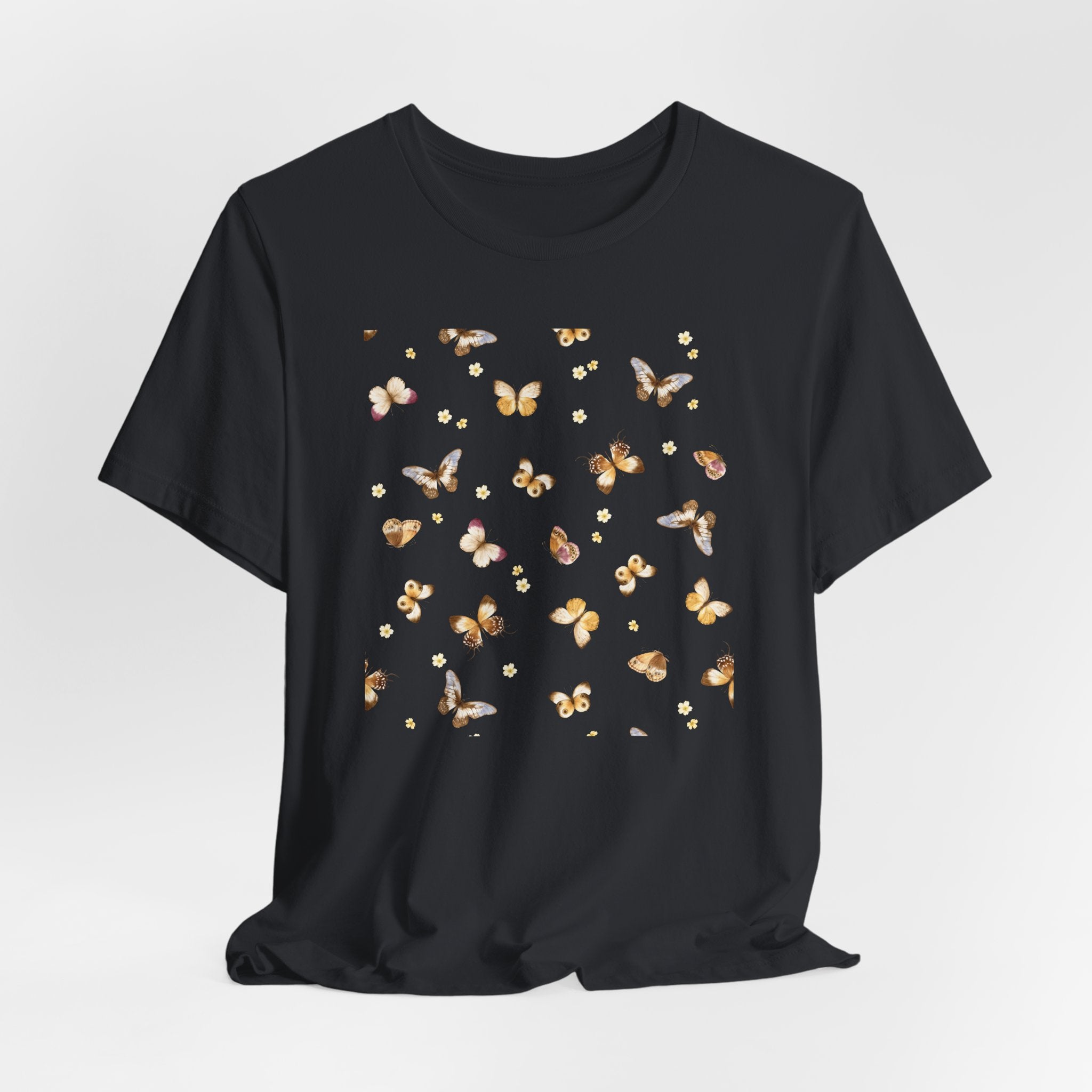 Black t-shirt with butterfly pattern on a light gray background
