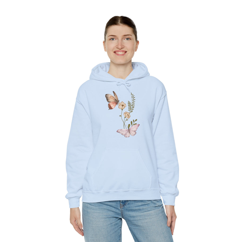 Light blue hoodie with floral and butterfly design worn by a person on a white background