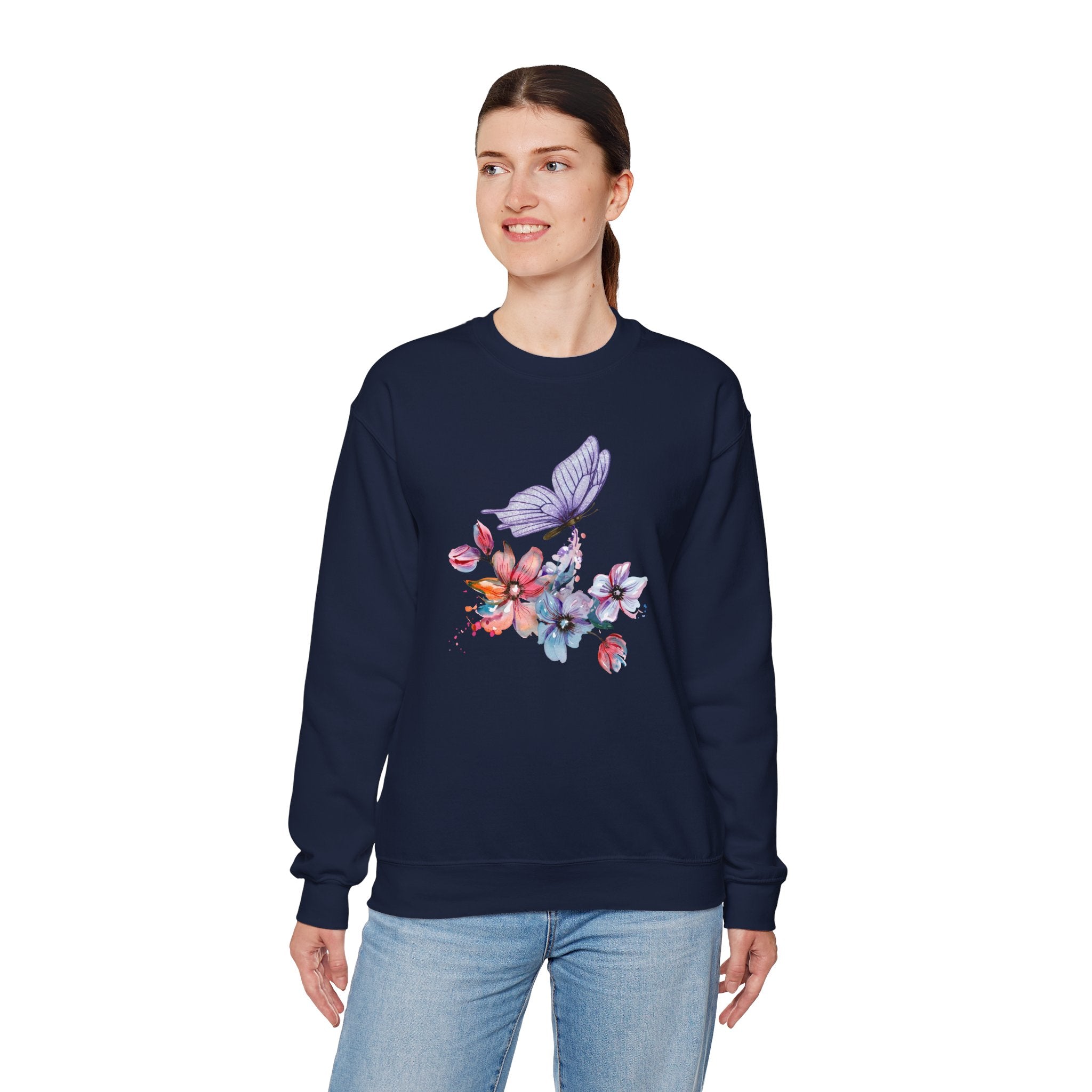 Woman wearing a navy sweatshirt with floral and butterfly design on a white background