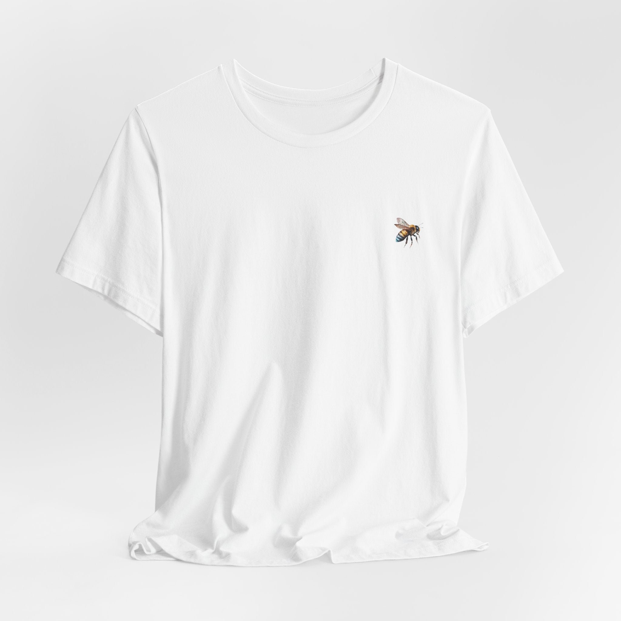 White  t-shirt with a bee design on a light gray background