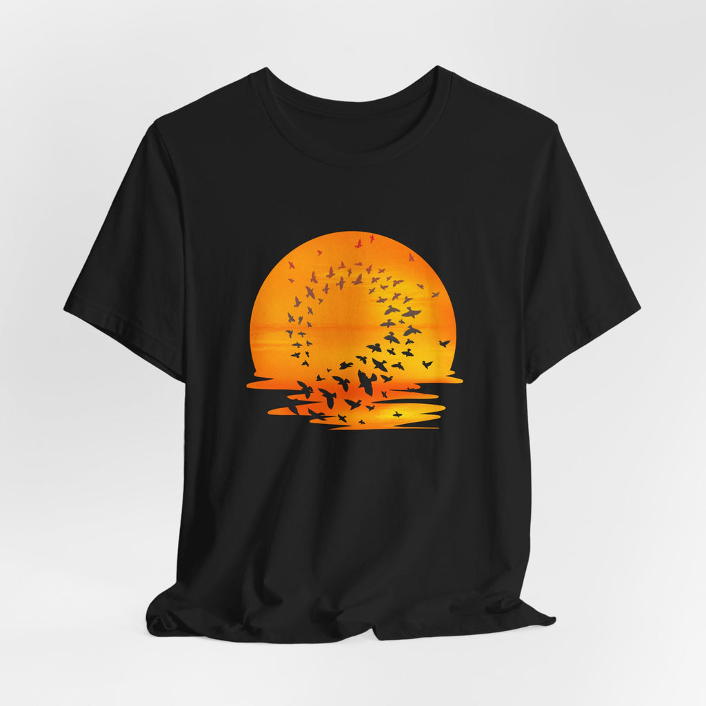 Black t-shirt with an orange sunset and bird design on a white background
