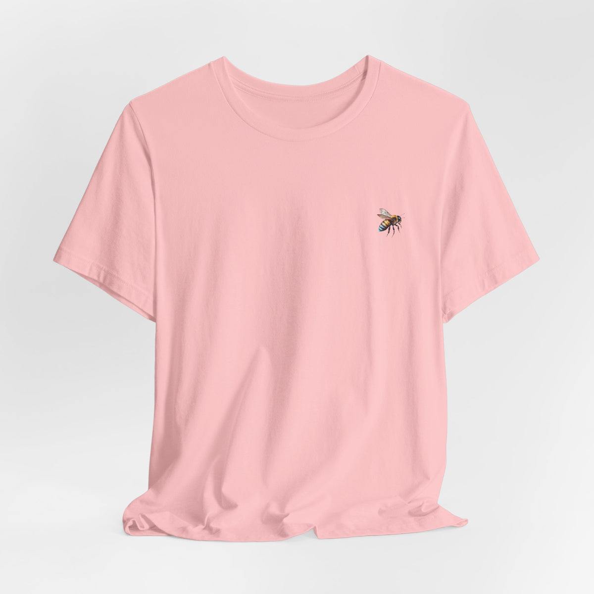 Pink t-shirt with bee graphic on a white background