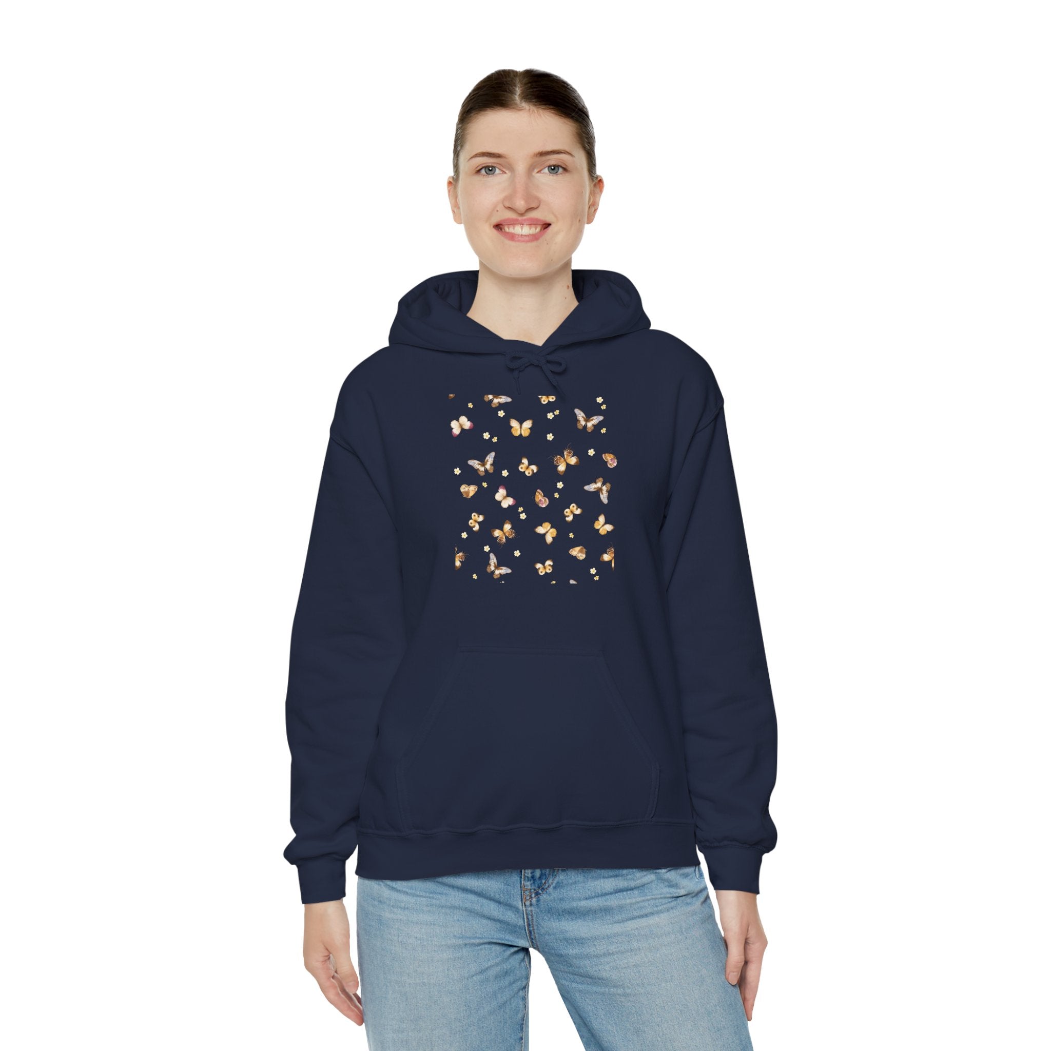 Person wearing a navy hoodie with butterfly design on a white background