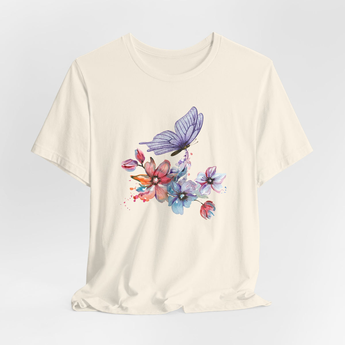 Beige t-shirt with a colorful butterfly and flower design on a light gray background