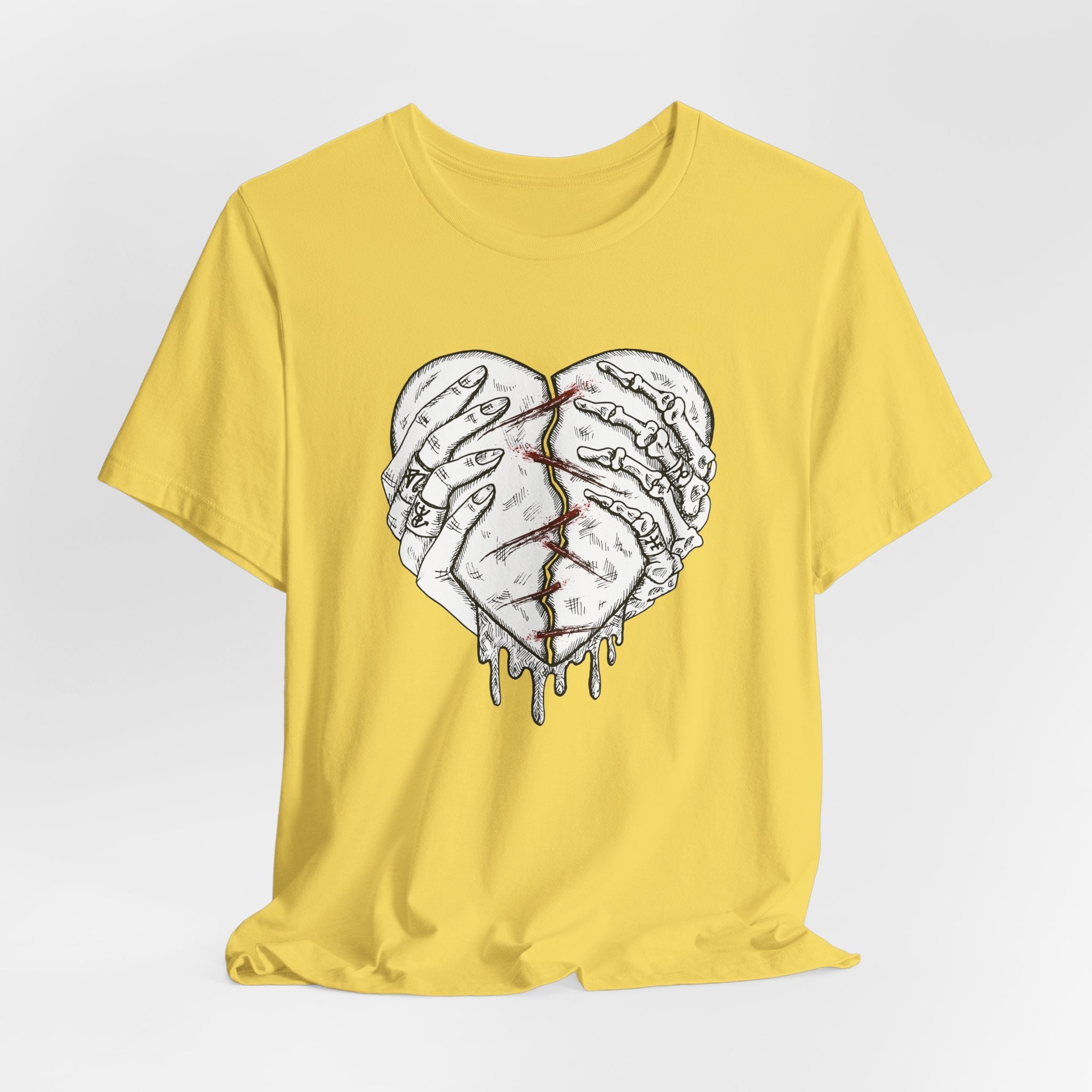 Yellow t-shirt with a graphic of two hands forming a heart on a white background