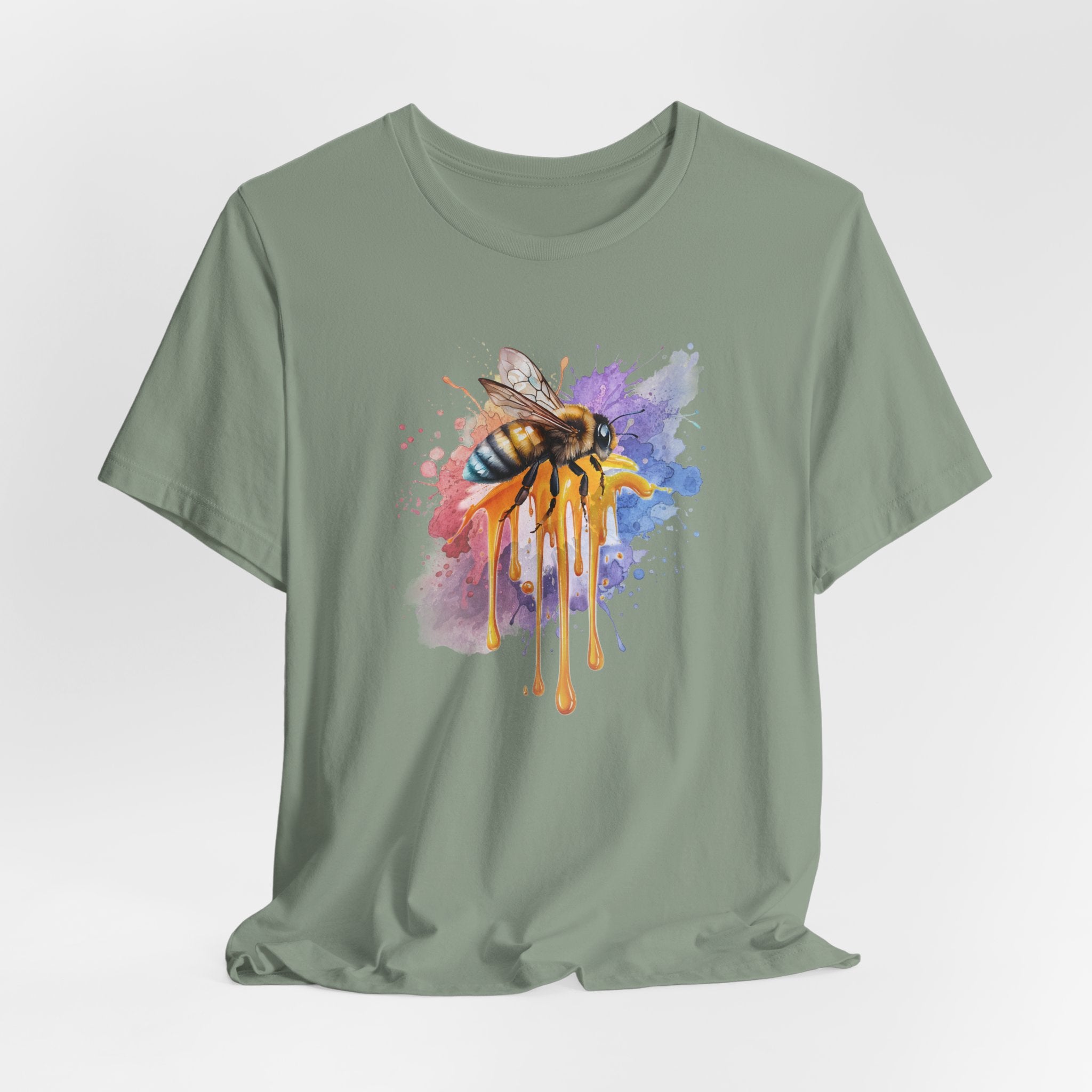 Green t-shirt with a colorful bee graphic on a light gray background