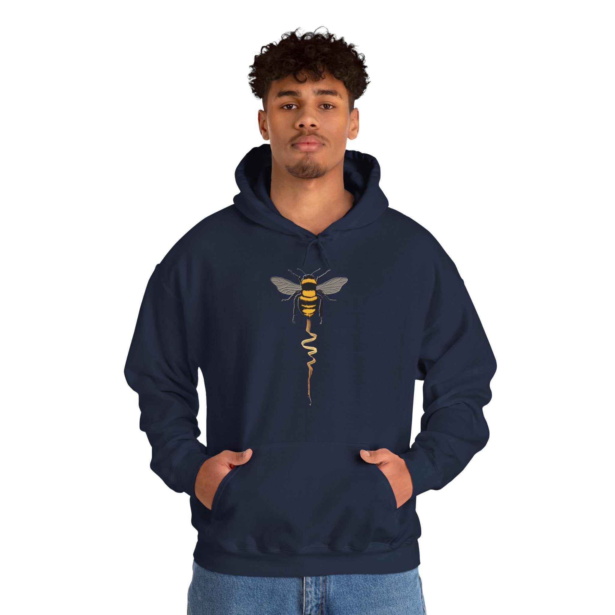 Person wearing a navy hoodie with a bee design on a white background