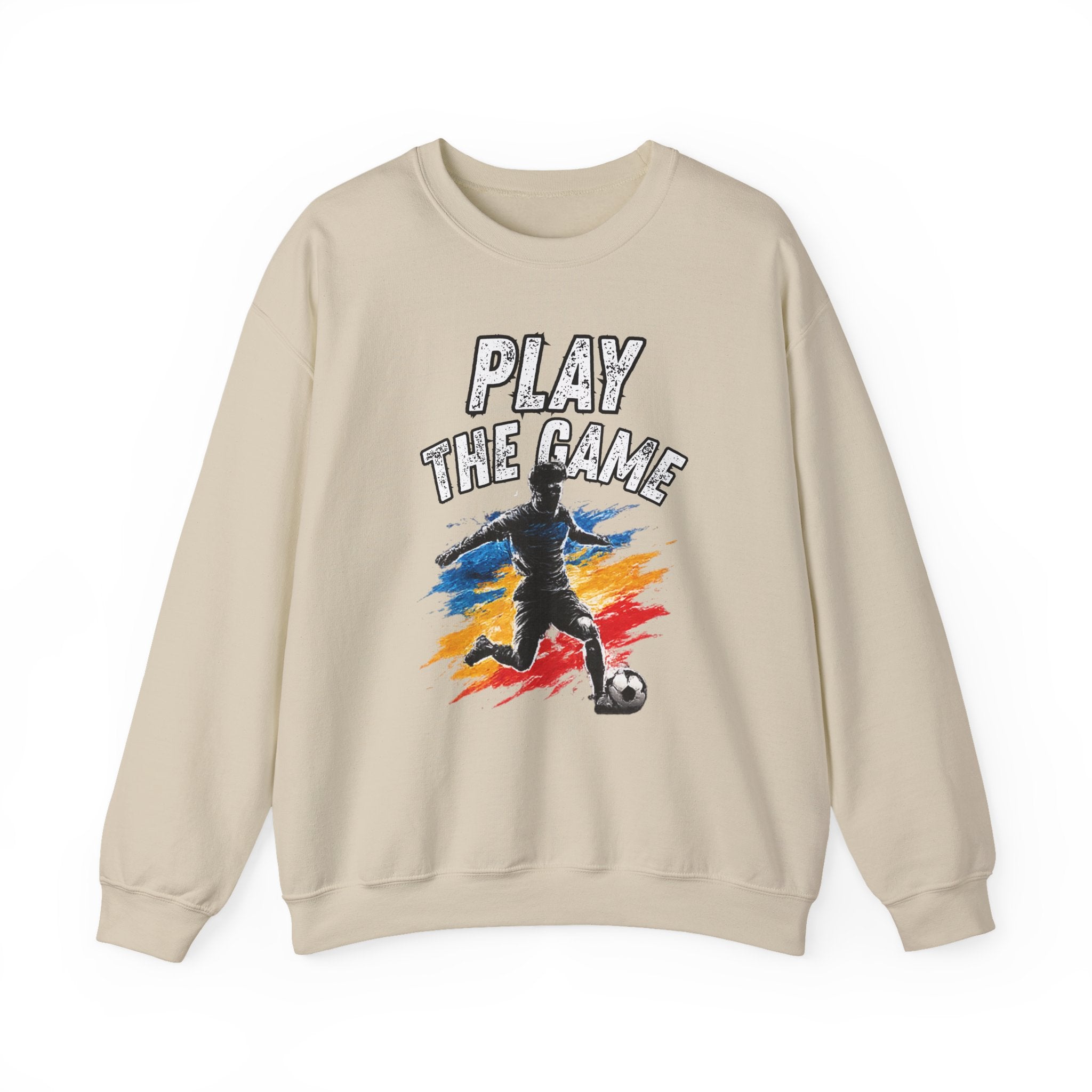 Beige sweatshirt featuring a graphic print of a soccer player kicking a ball with the text 'PLAY THE GAME' in white, set against a plain white background.