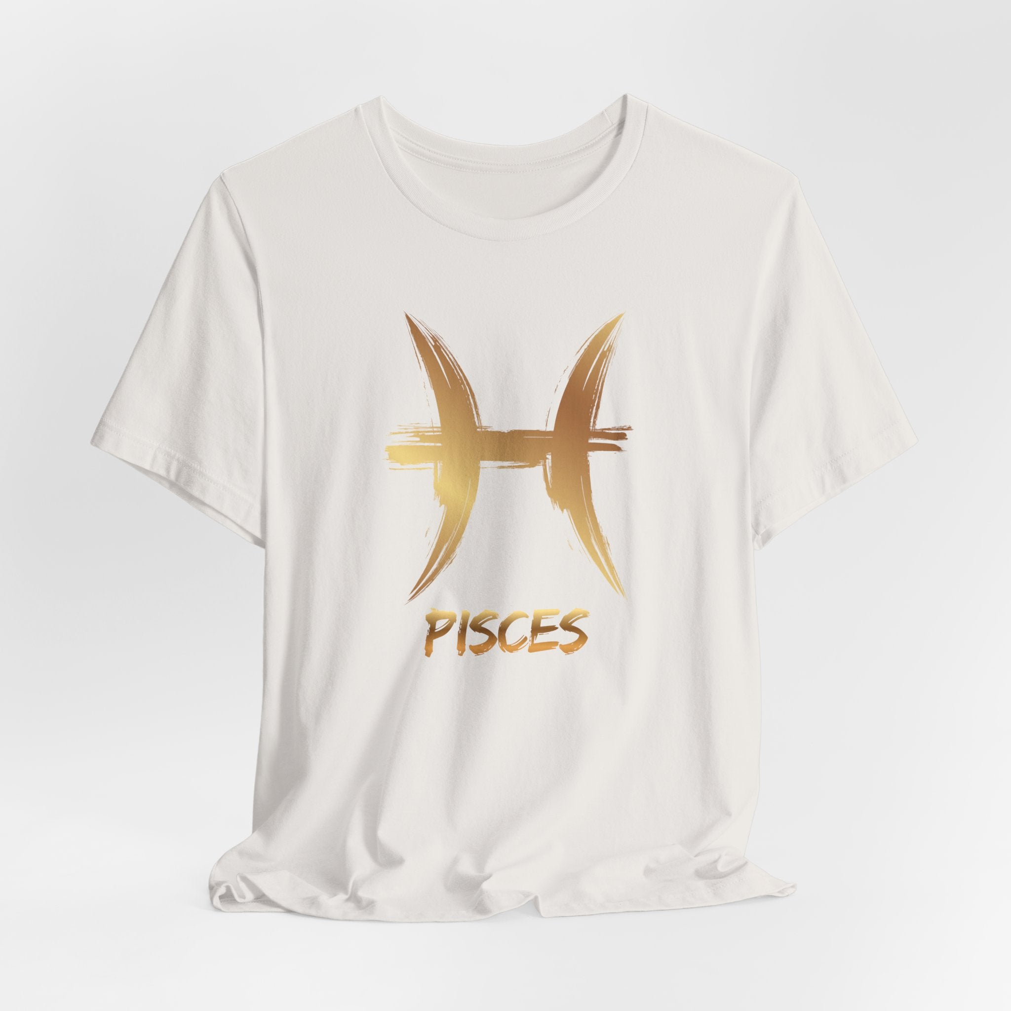 White t-shirt with gold Pisces symbol and text on a light gray background