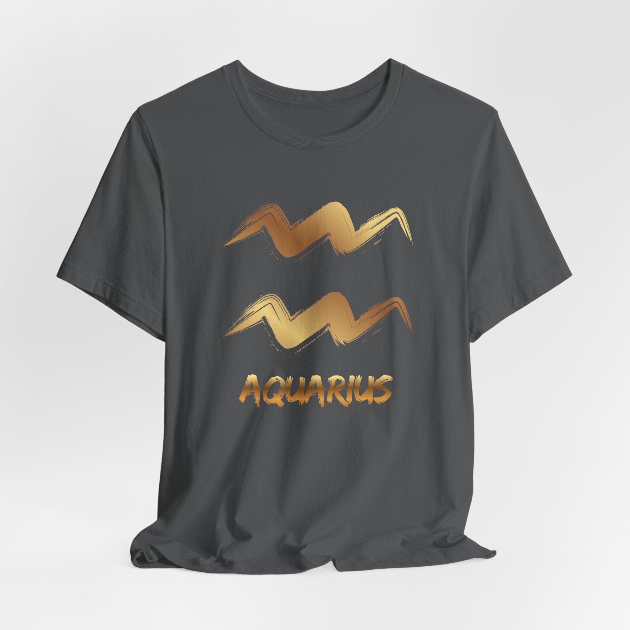 Black t-shirt with gold Aquarius zodiac sign design on a light gray background