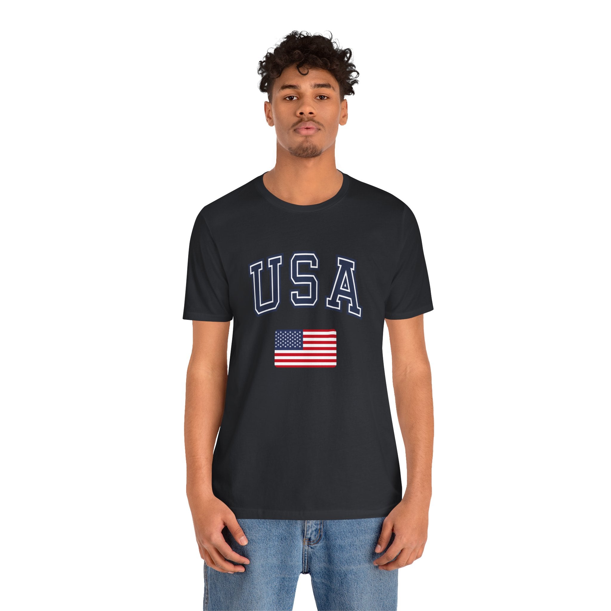Person wearing a black t-shirt with a graphic design and text on a white background