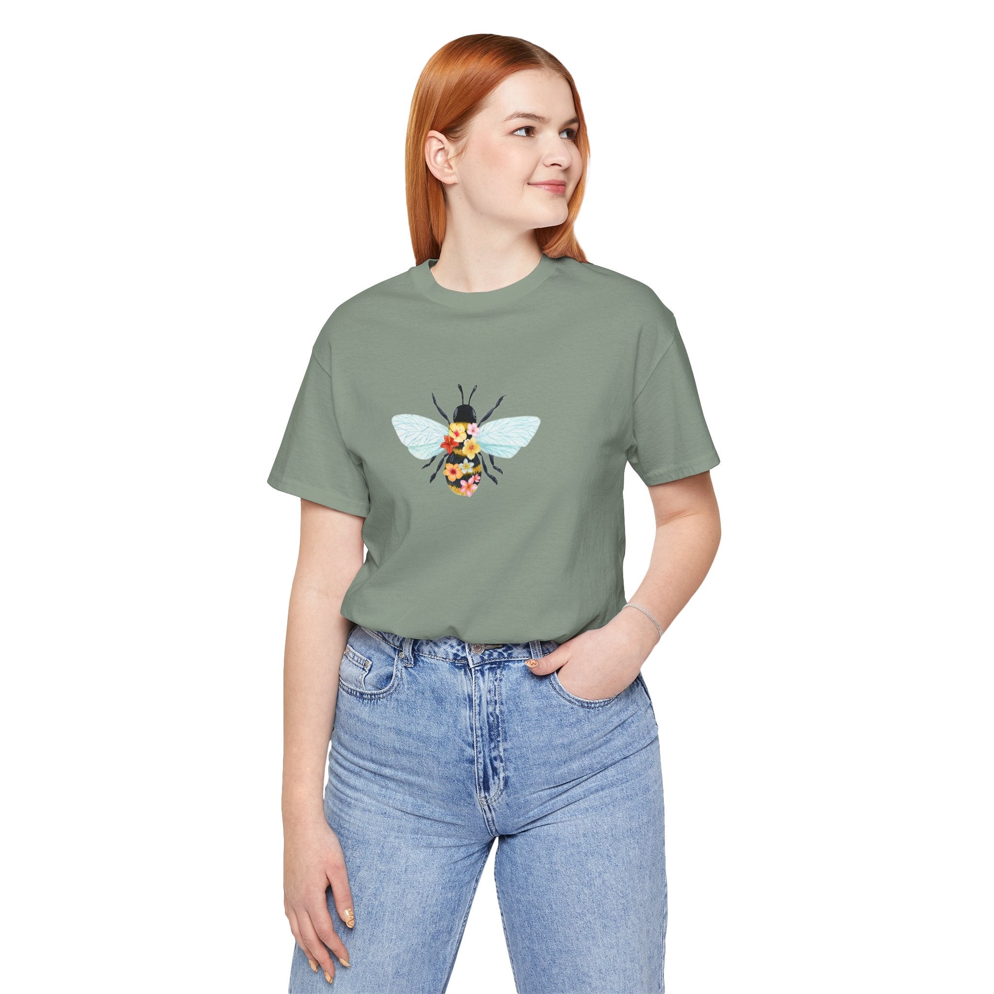 Person wearing a green t-shirt with text and graphics on a white background