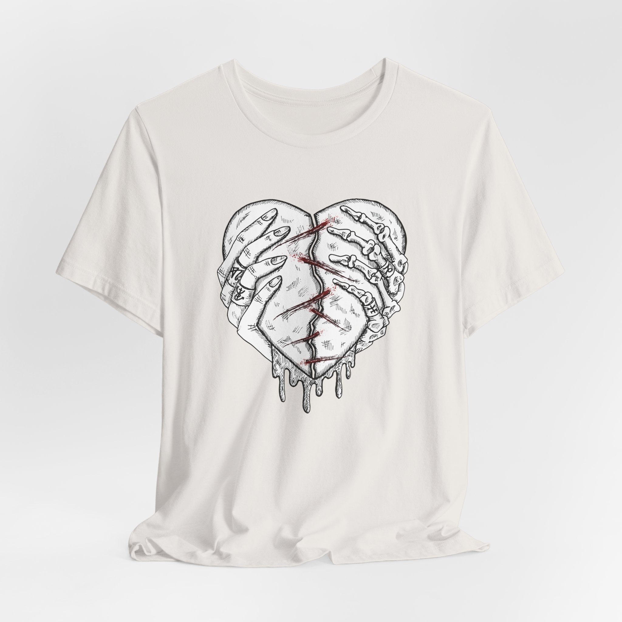 White t-shirt with a graphic design of a broken heart on a white background