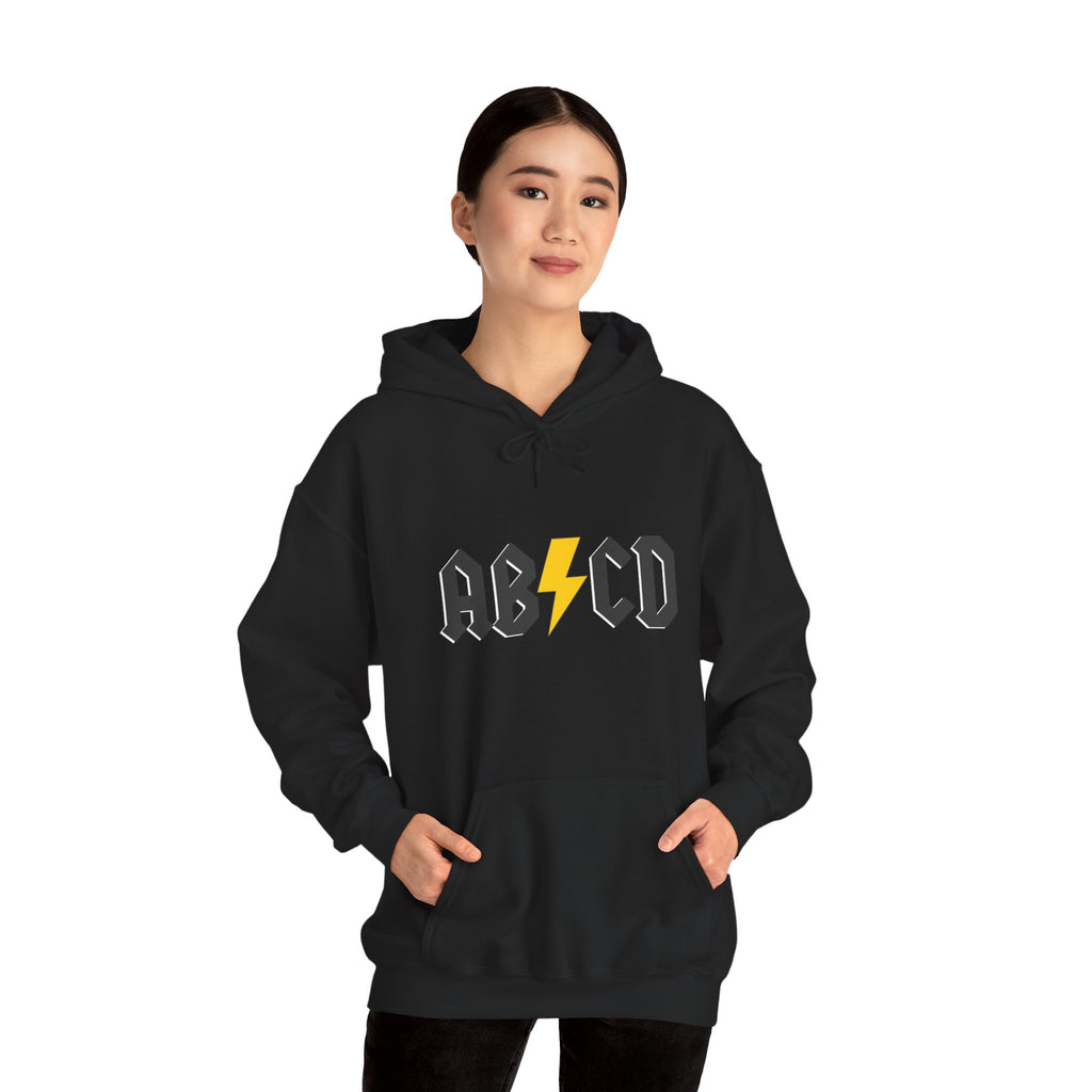 Person wearing a black hoodie with 'ABCD' logo featuring a lightning bolt on a white background