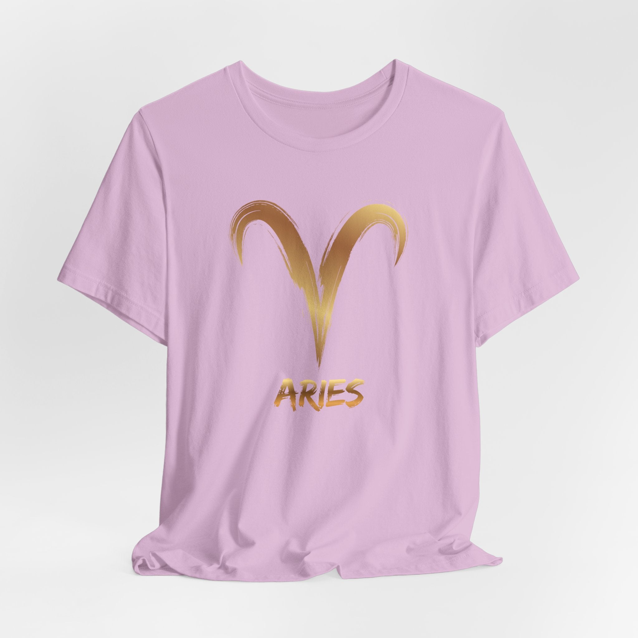 Lavender t-shirt with gold Aries symbol and text on a light gray background