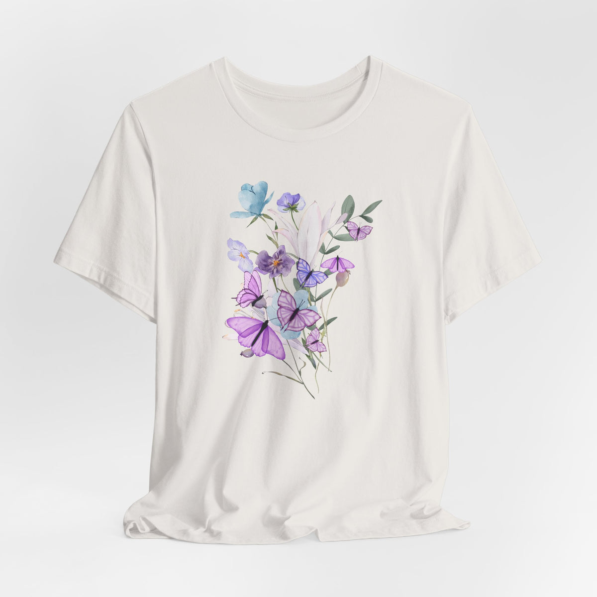 White t-shirt with floral design on a light gray background