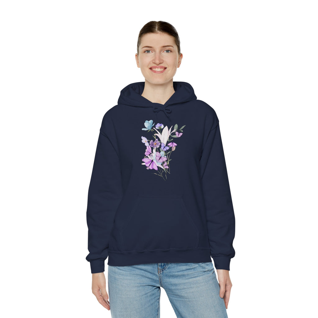 Person wearing a navy blue hoodie with floral design on a white background
