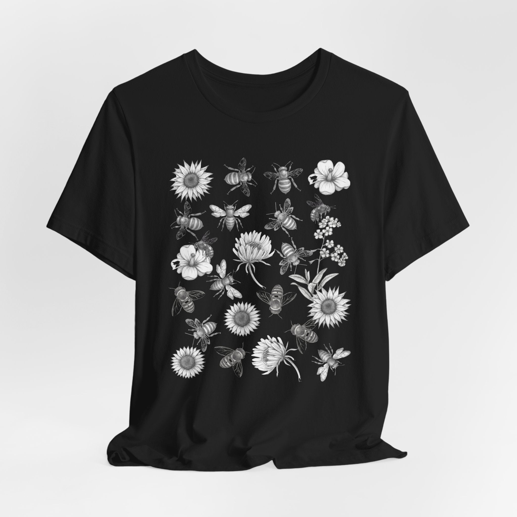 Black t-shirt with white graphic design on a light gray background