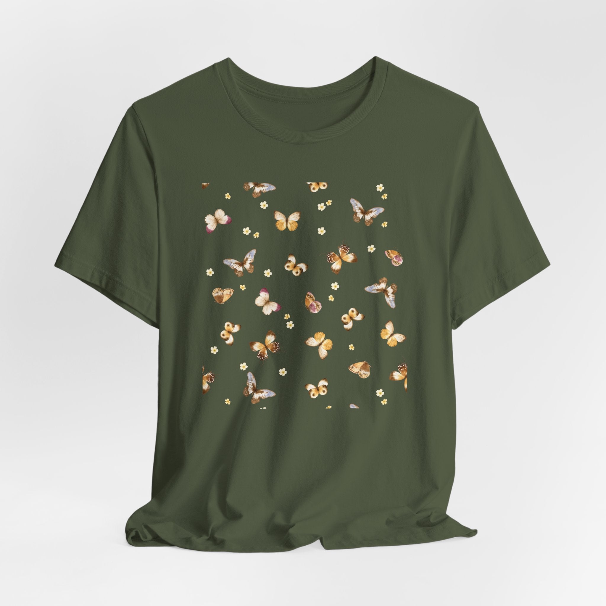 Green t-shirt with butterfly pattern on a light gray background