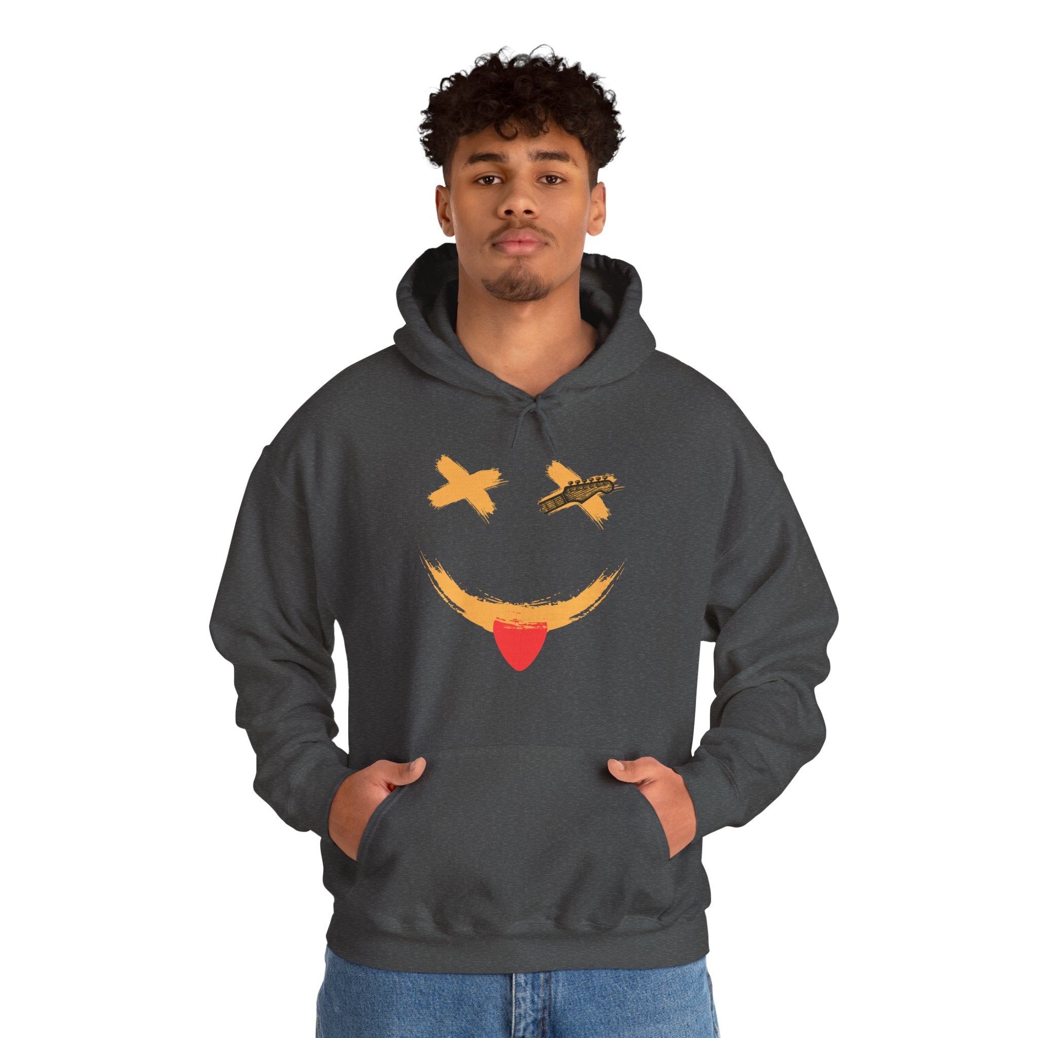 Person wearing a dark gray hoodie with a smiley face guitar graphic design on a white background