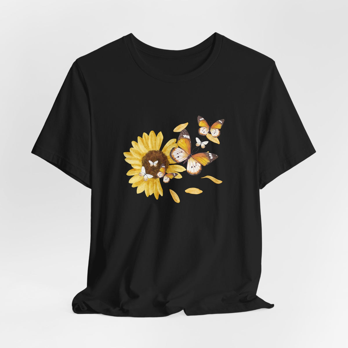 Black t-shirt with a sunflower and butterfly design on a white background