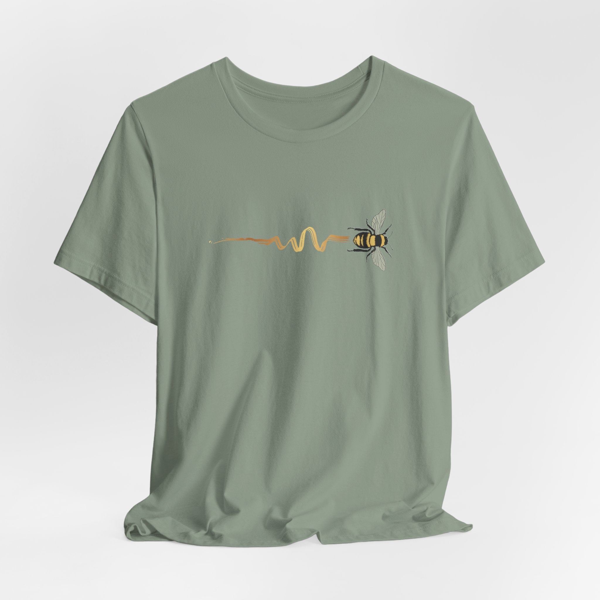 Sage t-shirt with a bee and pulse line design on a light gray background