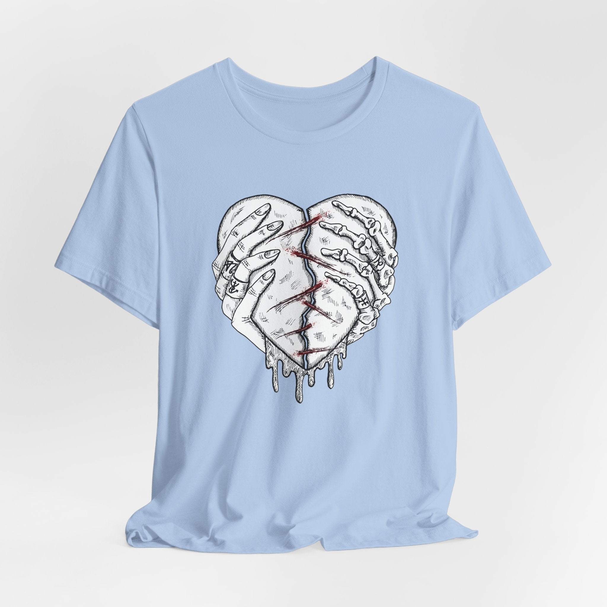 Light blue t-shirt with a graphic of a broken heart and hands on a white background