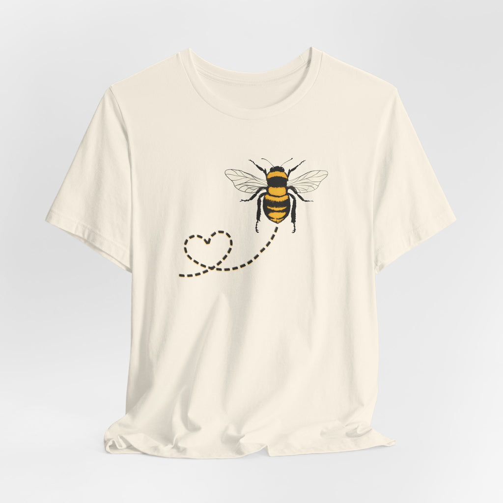 White t-shirt with a bee design on a light gray background
