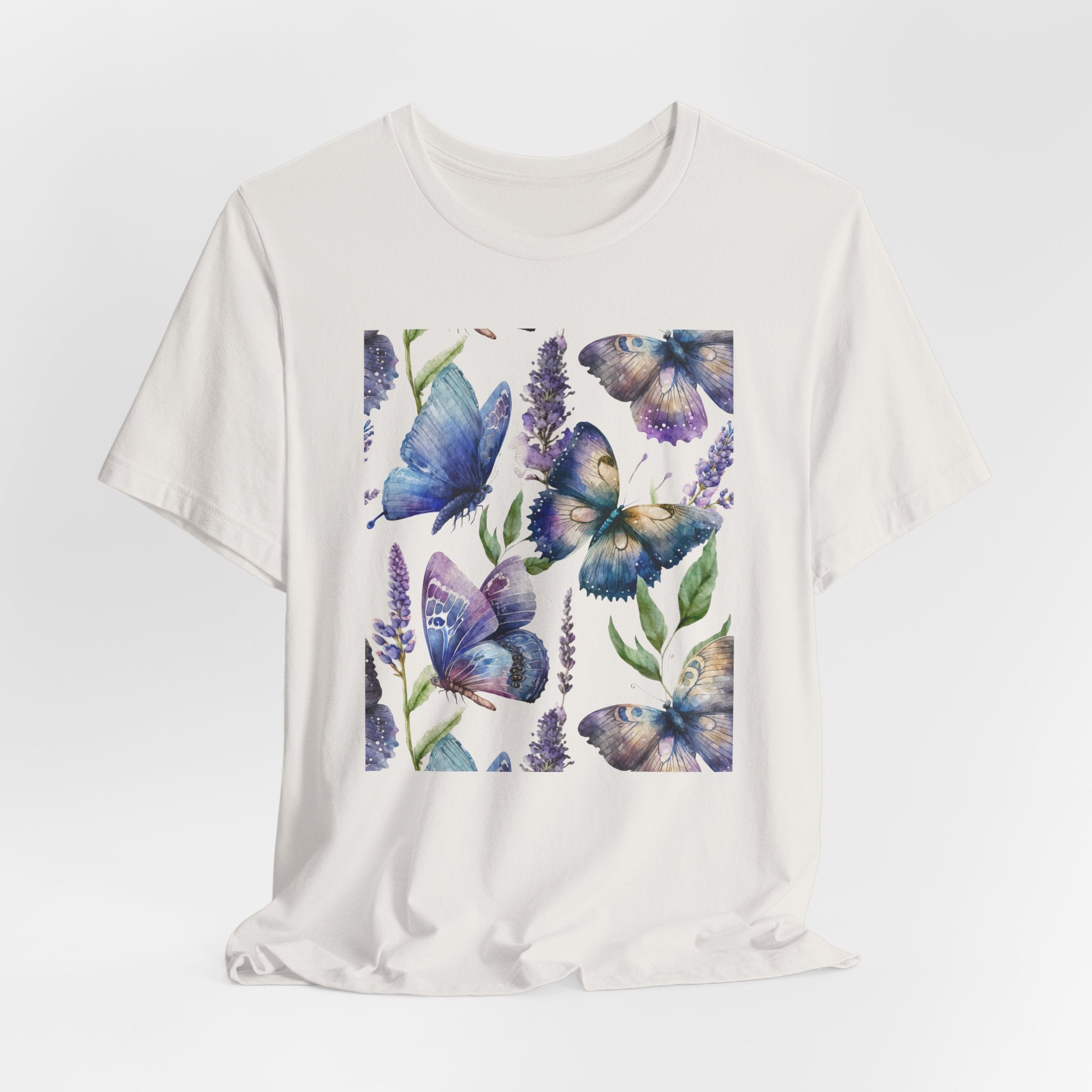 White t-shirt with a colorful butterfly design on a white background