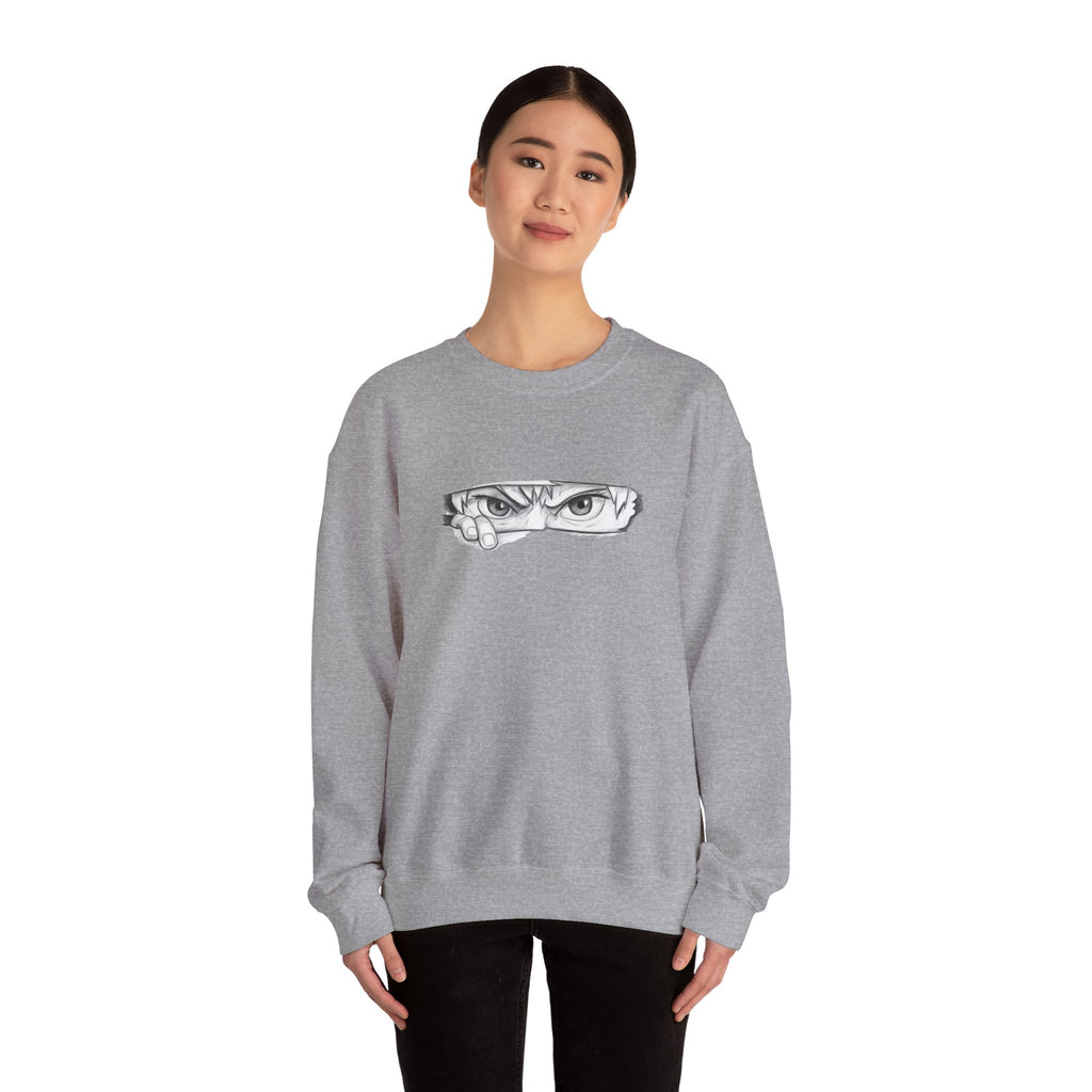Person wearing a gray sweatshirt with a anime eyes design on a white background