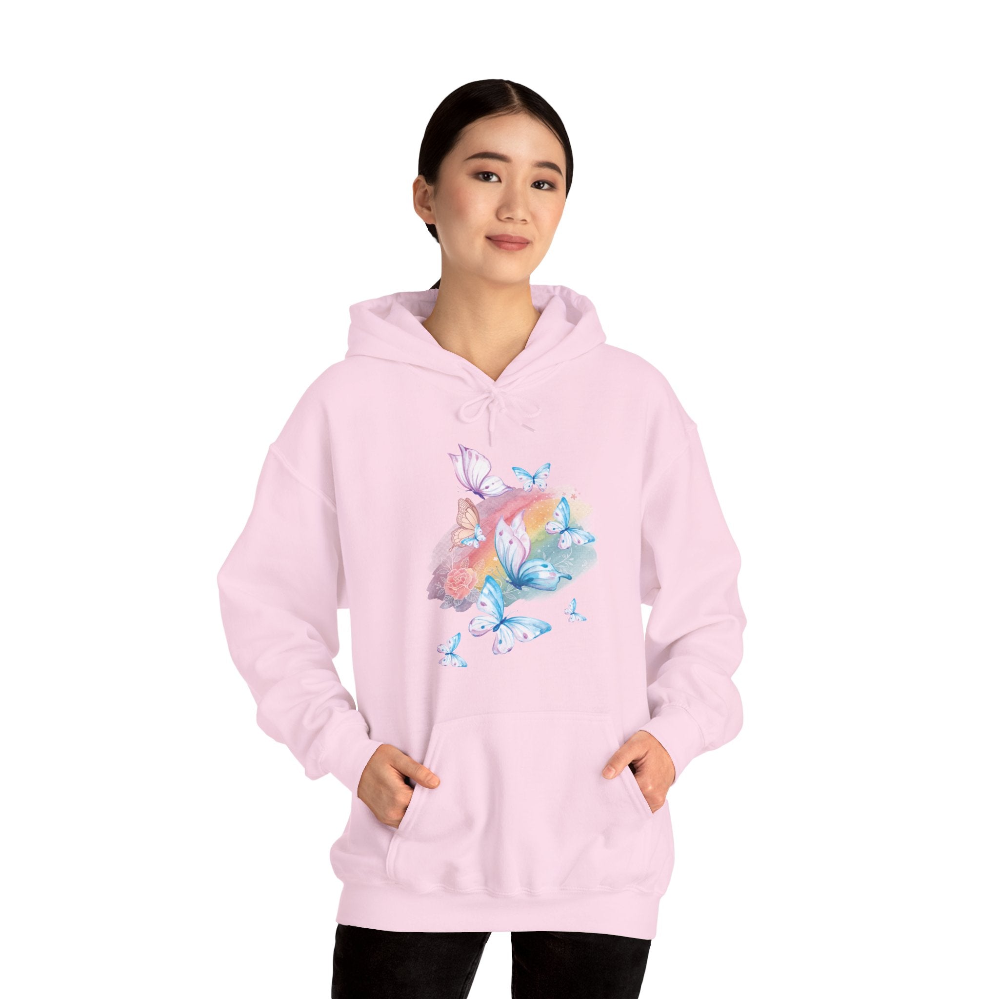 Person wearing a pink hoodie with butterfly design on a white background