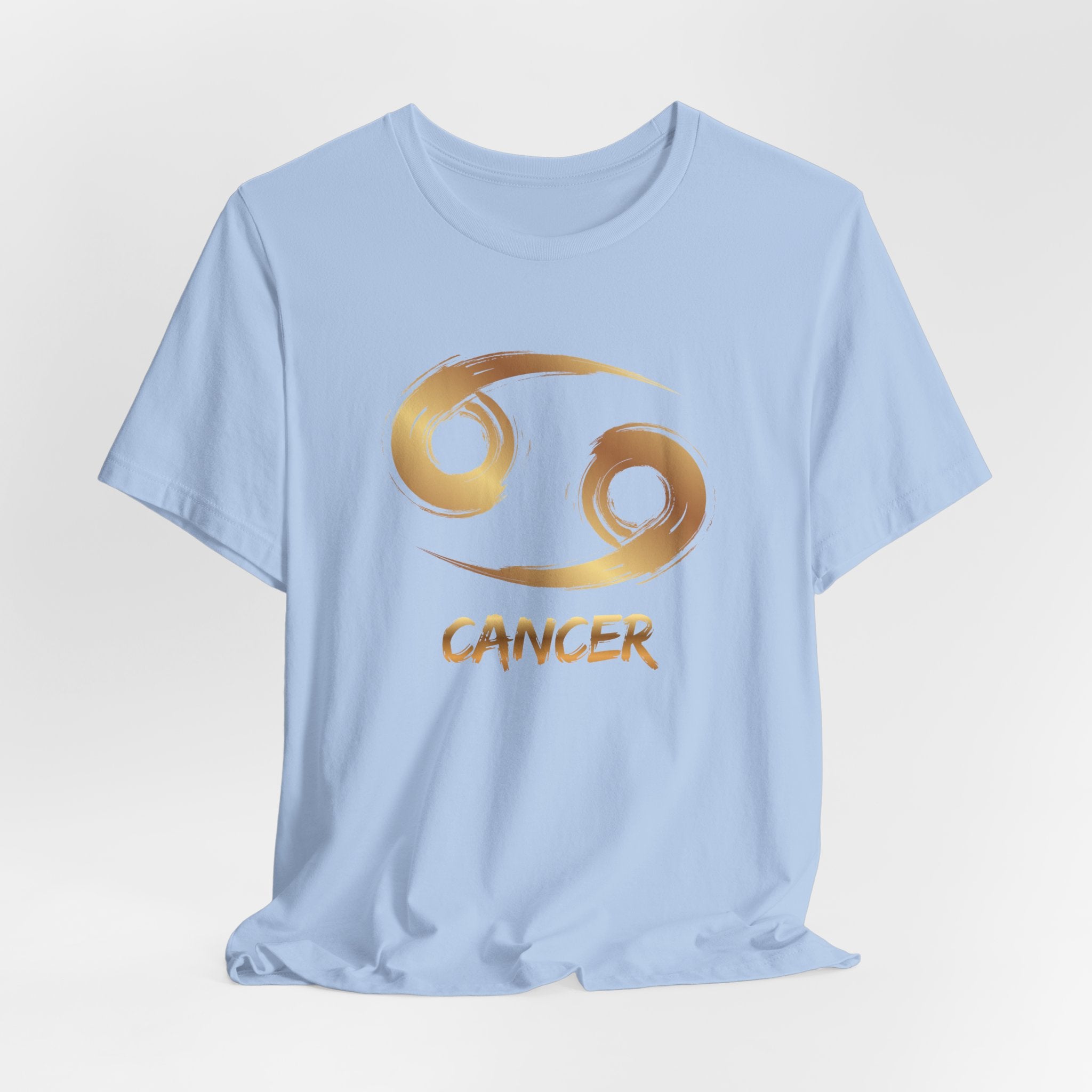 Light blue t-shirt with gold Cancer zodiac symbol on a light gray background