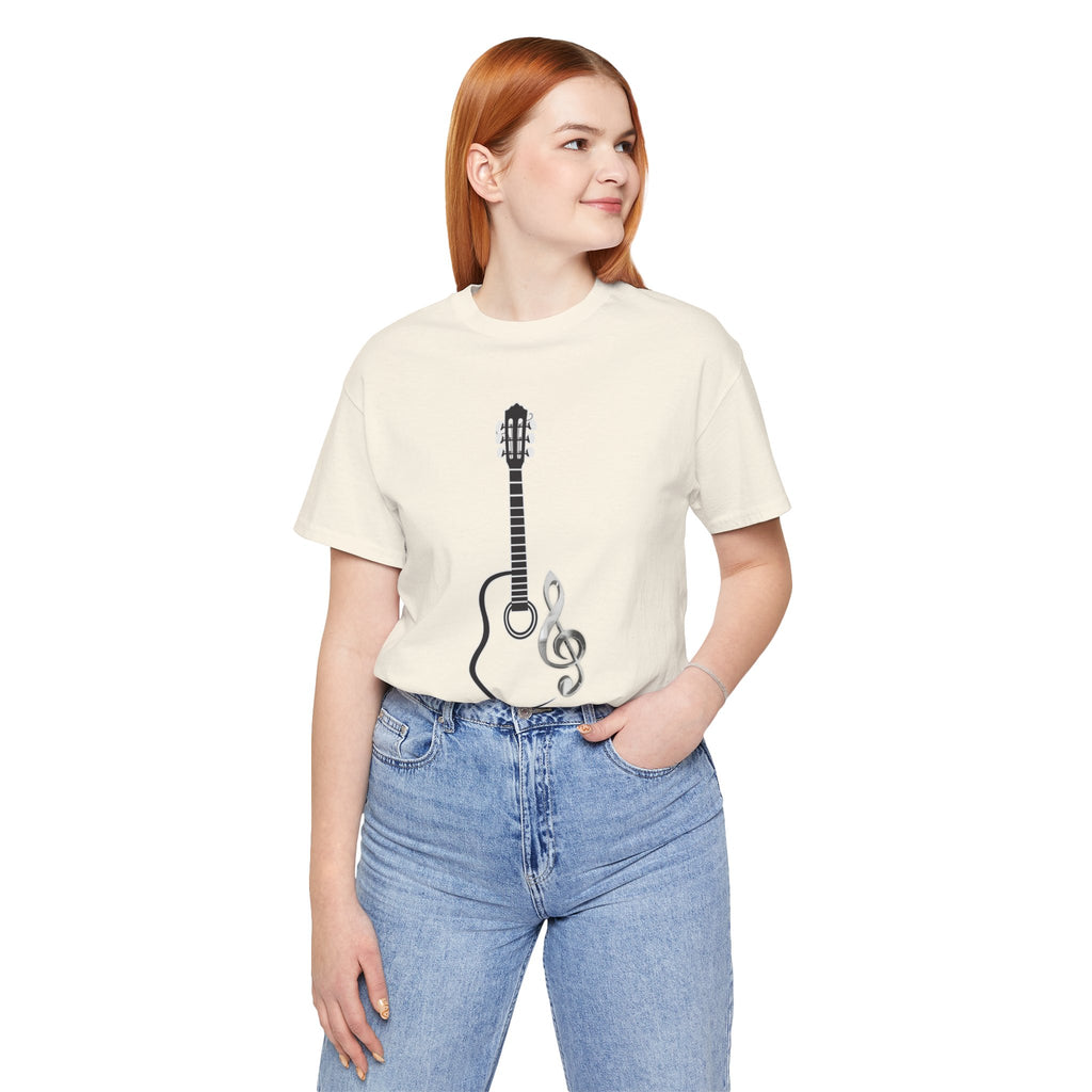 Person wearing a cream t-shirt with a guitar and treble clef design on a white background