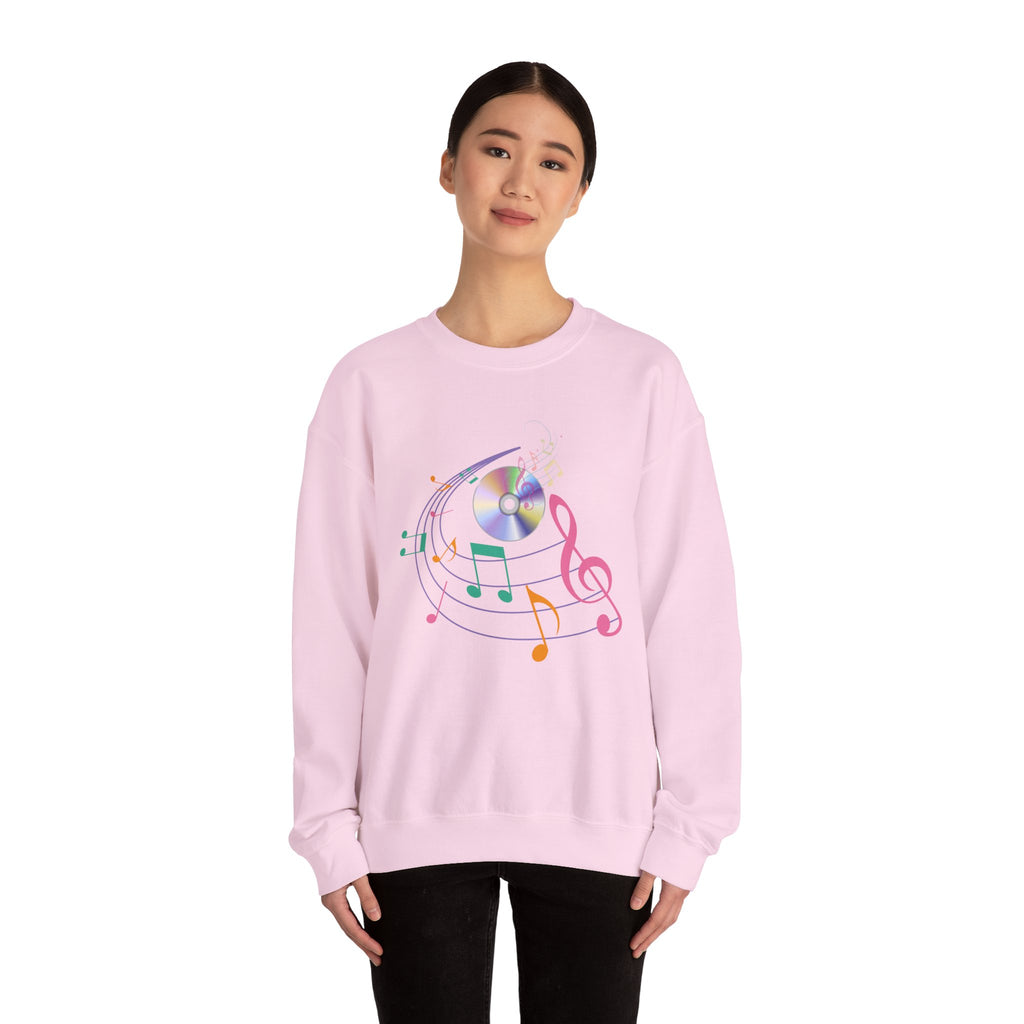 Person wearing a pink sweatshirt with a colorful music-themed design on a white background