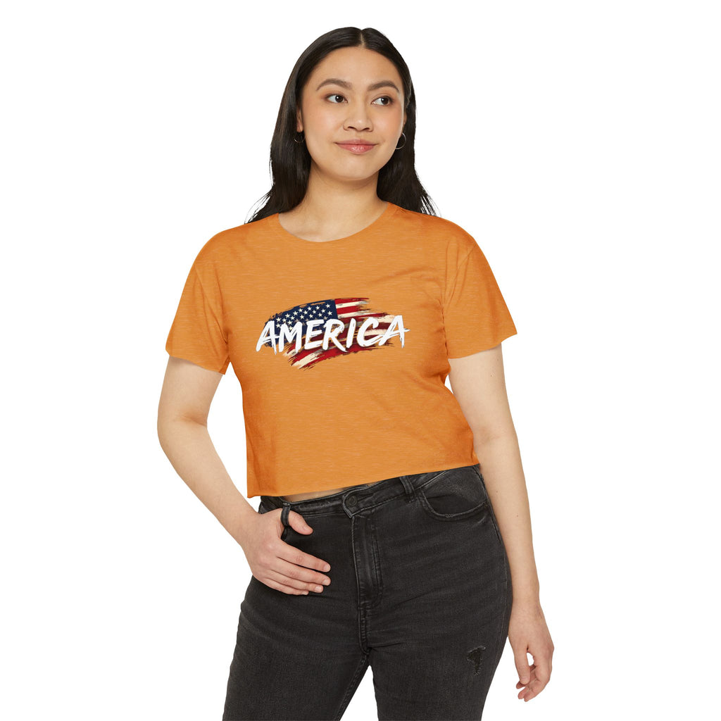 Person wearing an orange t-shirt with 'AMERICA' and an American flag design on a white background