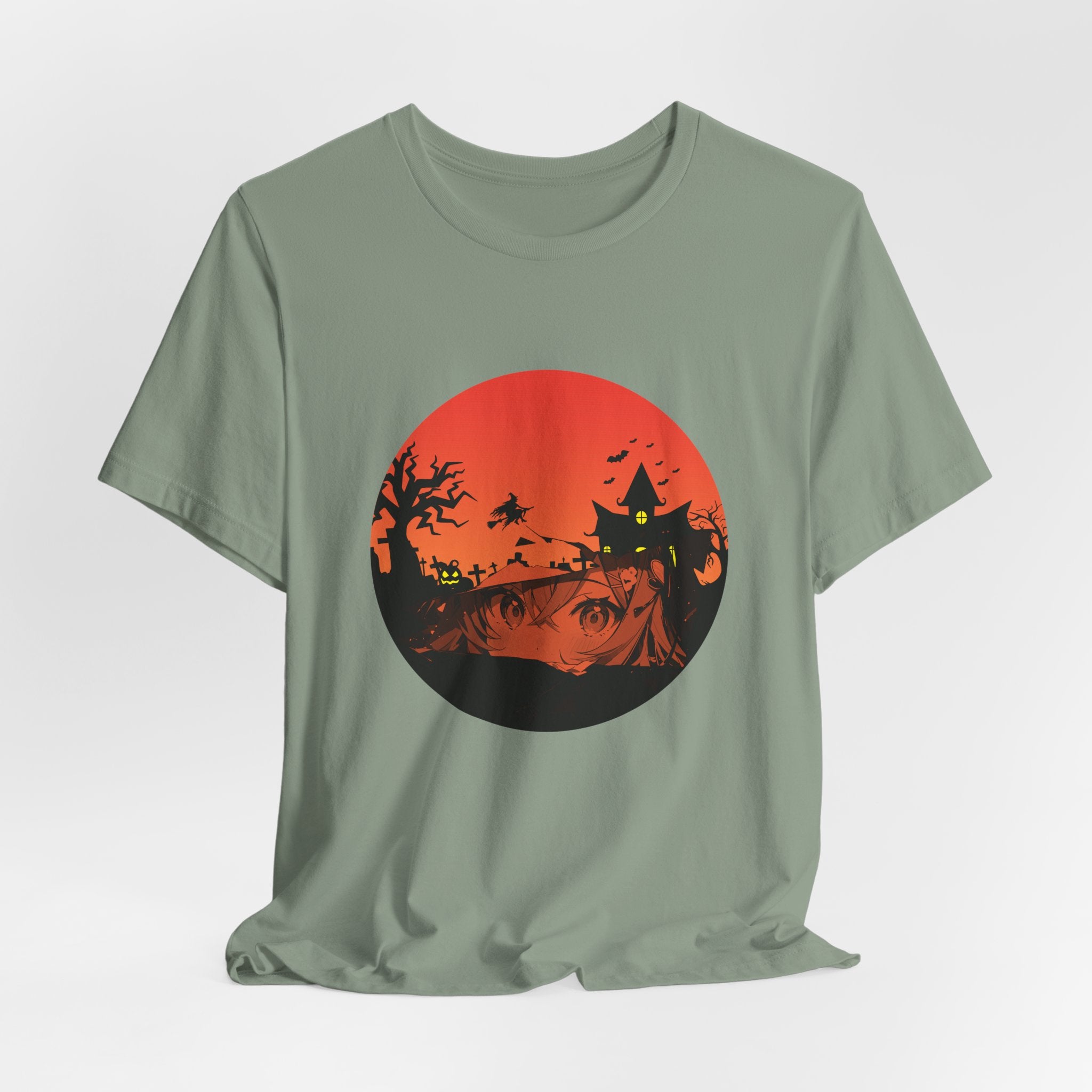 Sage green t-shirt with a Halloween-themed graphic on a light gray background
