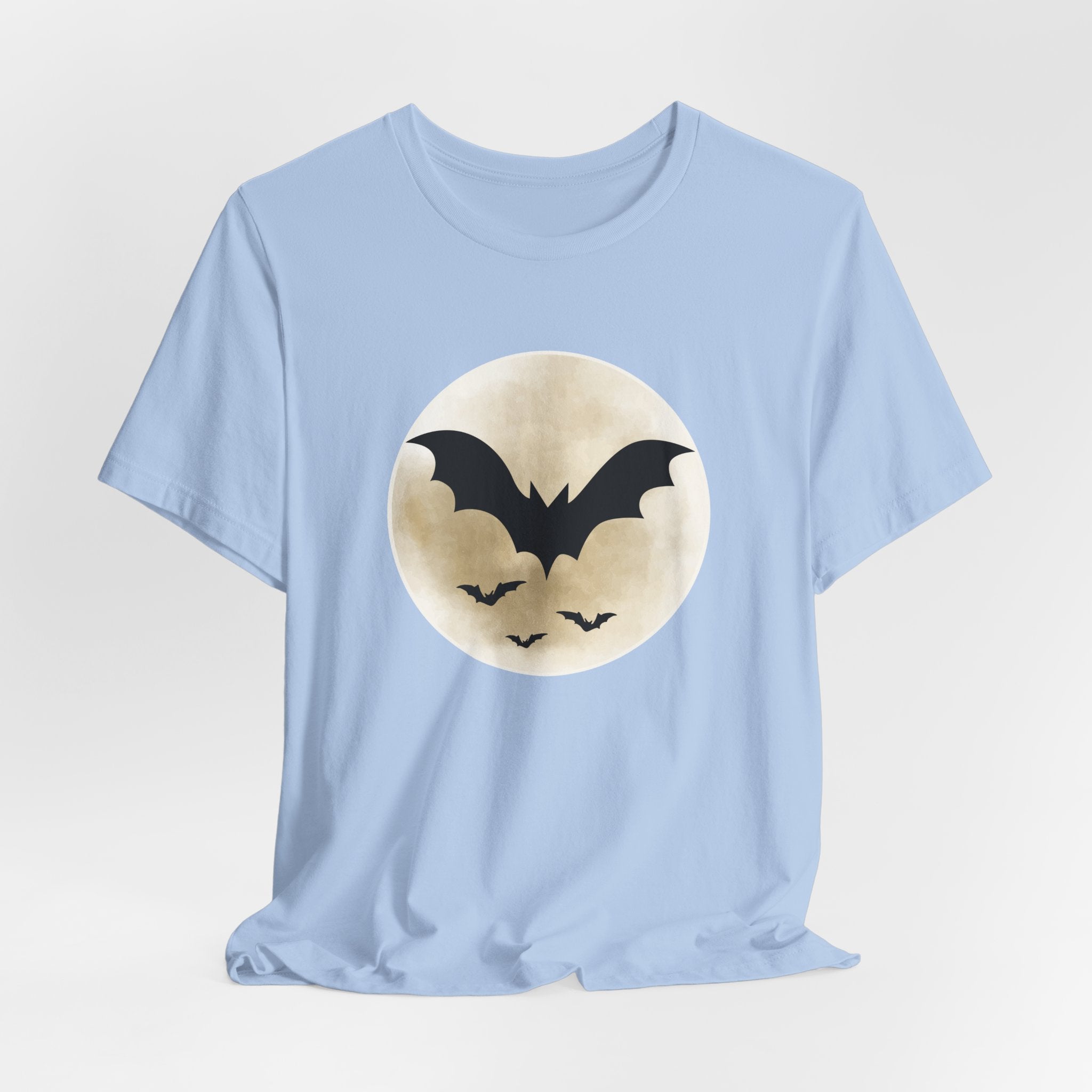 Light blue t-shirt with full moon and bats design on a light gray background
