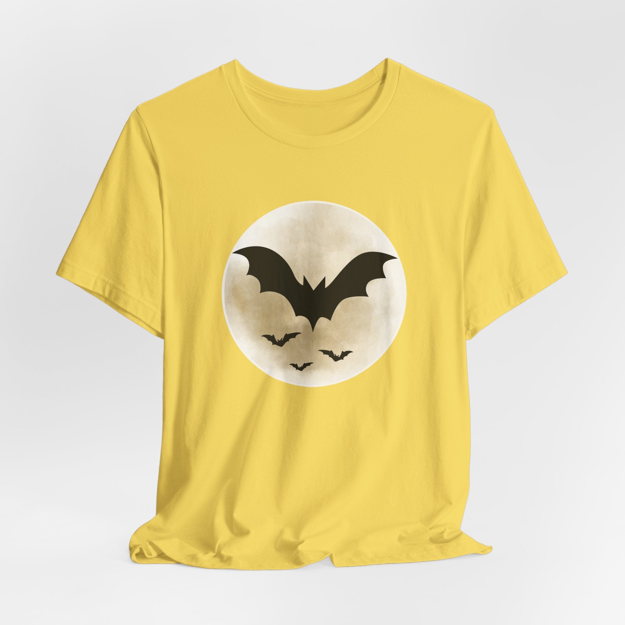 Maze yellow t-shirt with full moon and bats design on a light gray background