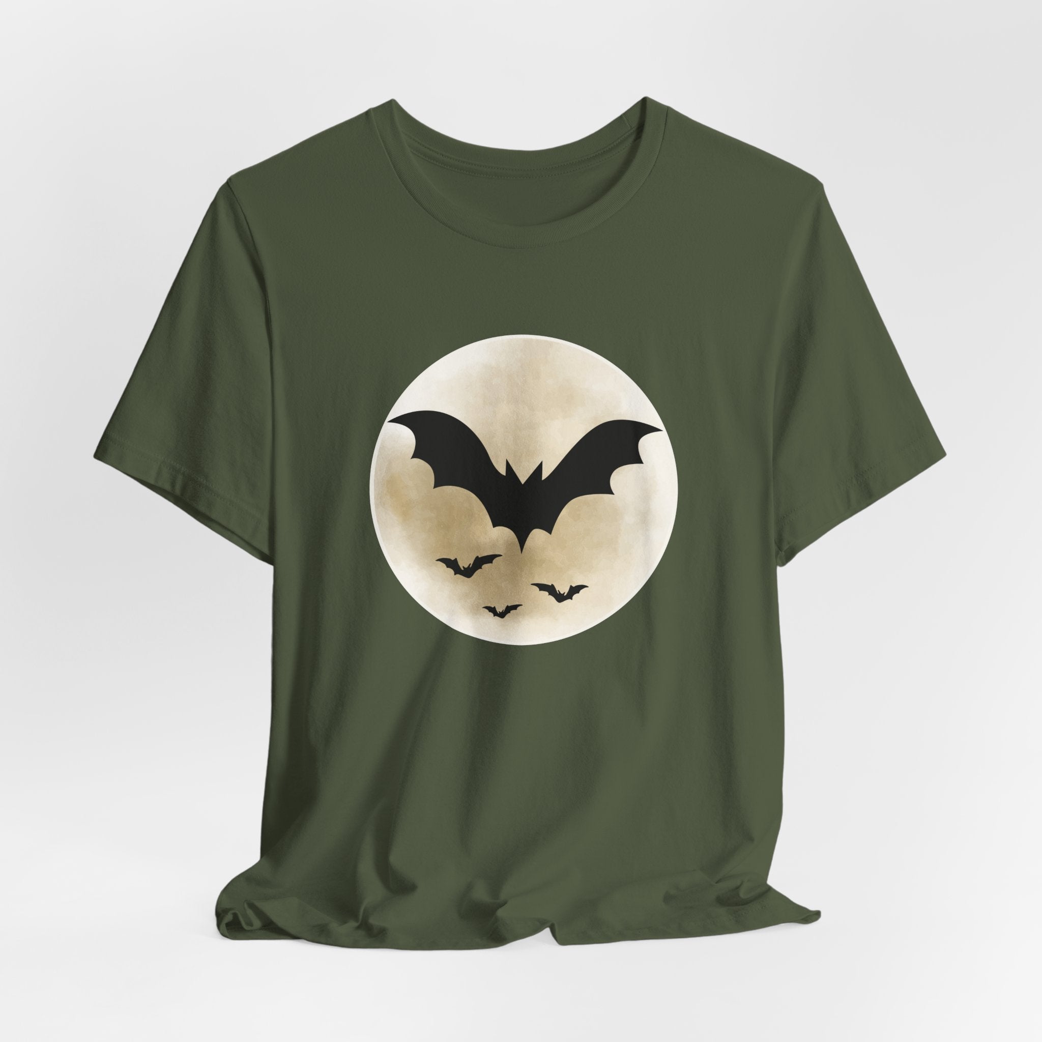Military green t-shirt with full moon and bats design on a light gray background
